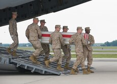 A U.S. Marine Corps team transfers the remains of Marine Corps Lance Cpl. Philip P. Clark of Gainsville, FL., at Dover Air Force Base, Del., on May 19, 2010. (U.S. Air Force photo/Brianne Zimny)