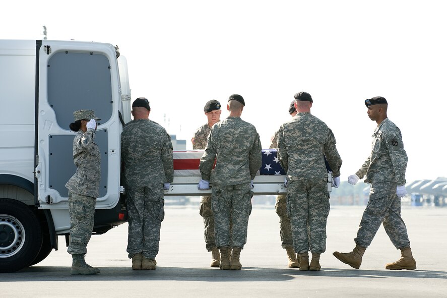 26 May 2010  USAF Photo by Jason Minto.  A U.S. Army carry team transfers the remains of Army SPC Christopher Ryan Barton of Concord, NC. at Dover Air Force Base, Del., May 26, 2010.