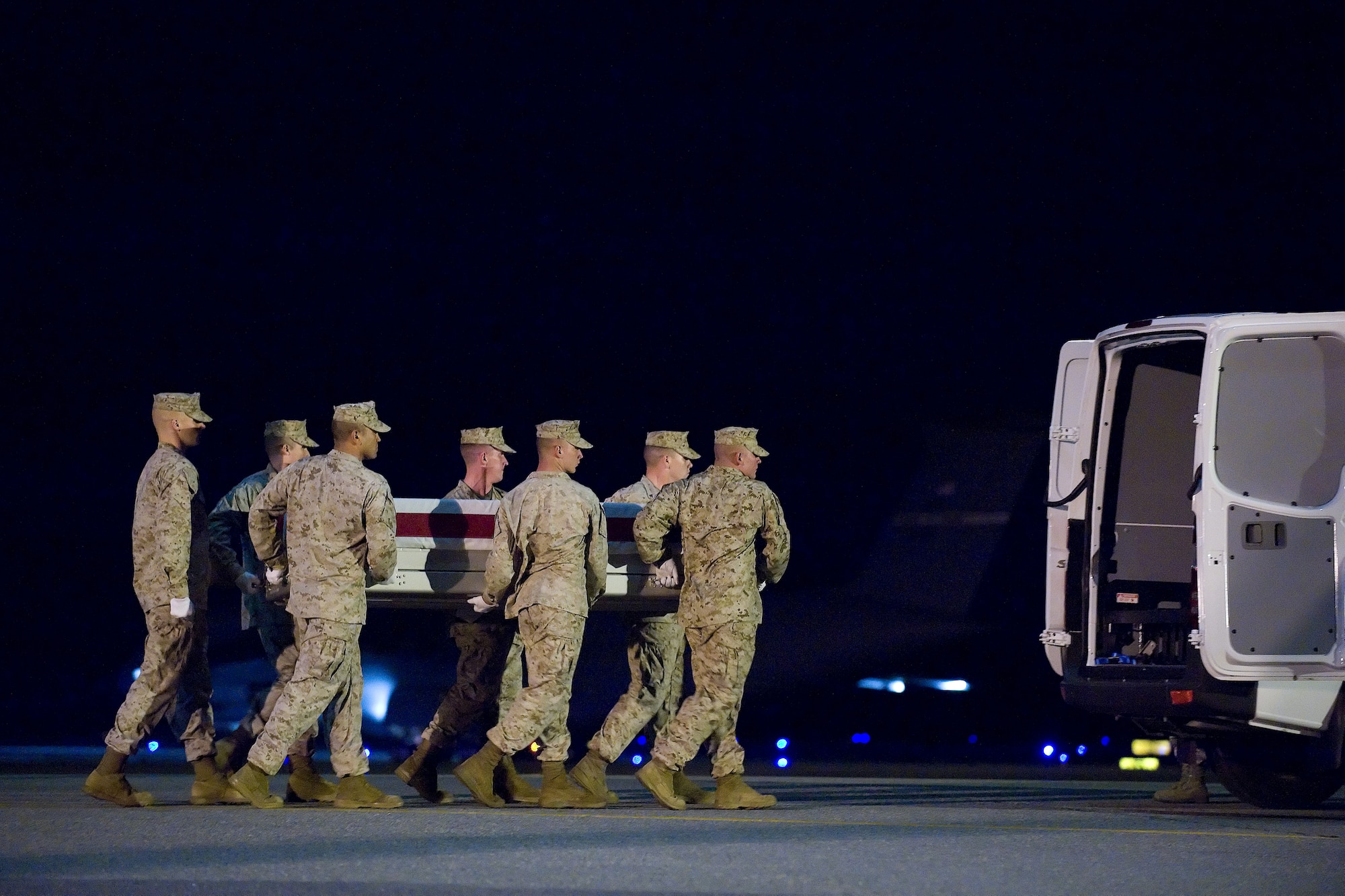 1 June 2010  USAF Photo by Jason Minto.  A U.S. Marine Corps carry team transfers the remains of Marine LCpl Anthony A. Dilisio of Macomb, MI., at Dover Air Force Base, Del., June 1, 2010.