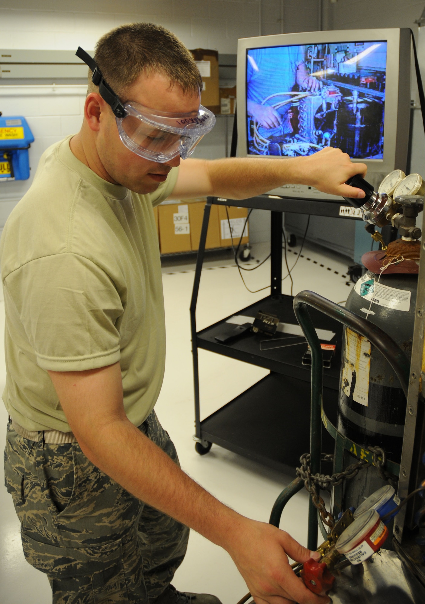 Staff Sgt. Rodney Douglas, an electrical and environmental systems journeyman with the 512th Aircraft Maintenance Squadron, uses nitrogen to check an aircraft refridgerator for leaks. The six reservists assigned to the 512th Electrical and Environmental Systems shop troubleshoot, inspect and repair aircraft electrical and environmental systems and associated support equipment. Sergeant Douglas is a reservists assigned to the 512th Airlift Wing, the only Air Force Reserve Command unit in Delaware. (U.S. Air Force photo/Capt. Marnee A.C. Losurdo)