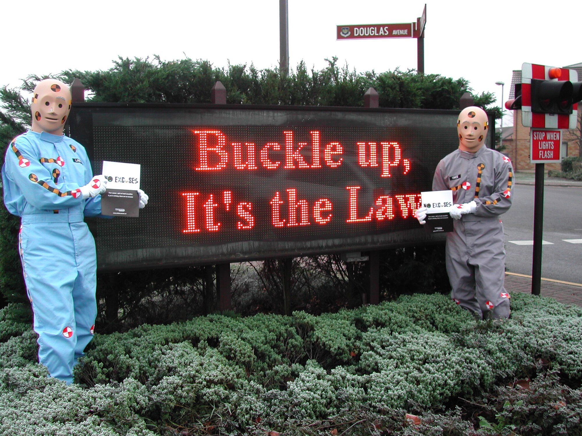 Crash Test Dummies Vince and Larry from the 48th Fighter Wing Safety Office, stand by the marquee to remind people to wear their seat belts and that there are no excuses for drinking and driving. (Courtesy Photo)

