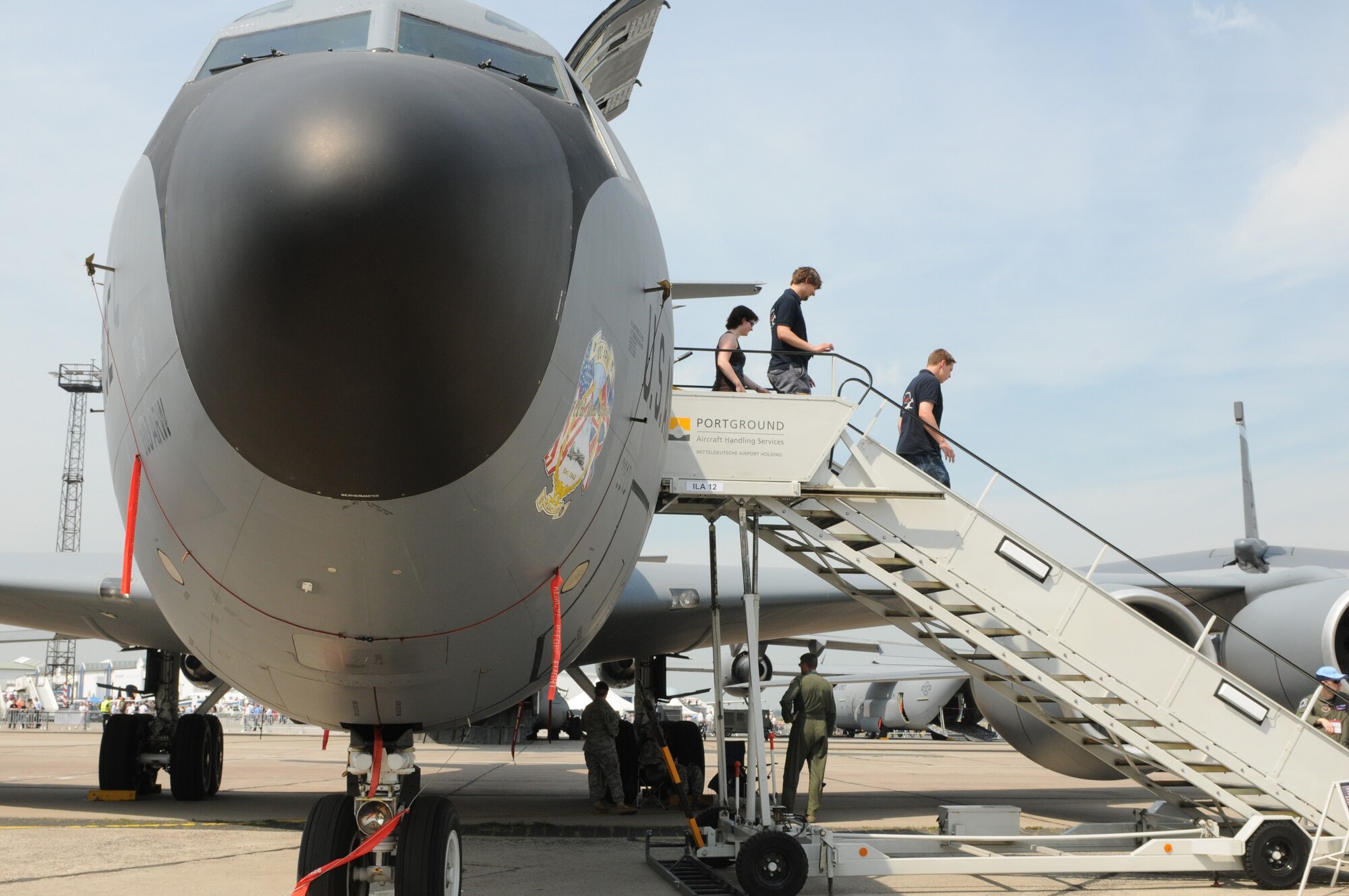 Visitors step out of the KC-135 Stratotanker after touring inside the aircraft during the ILA 2010 Berlin International Aerospace Exhibition and Conferences June 10. The Berlin Air Show is a weeklong event that showcases various aviation technologies from all over the world. (U.S. Air Force photo/Staff Sgt. Julius Delos Reyes)