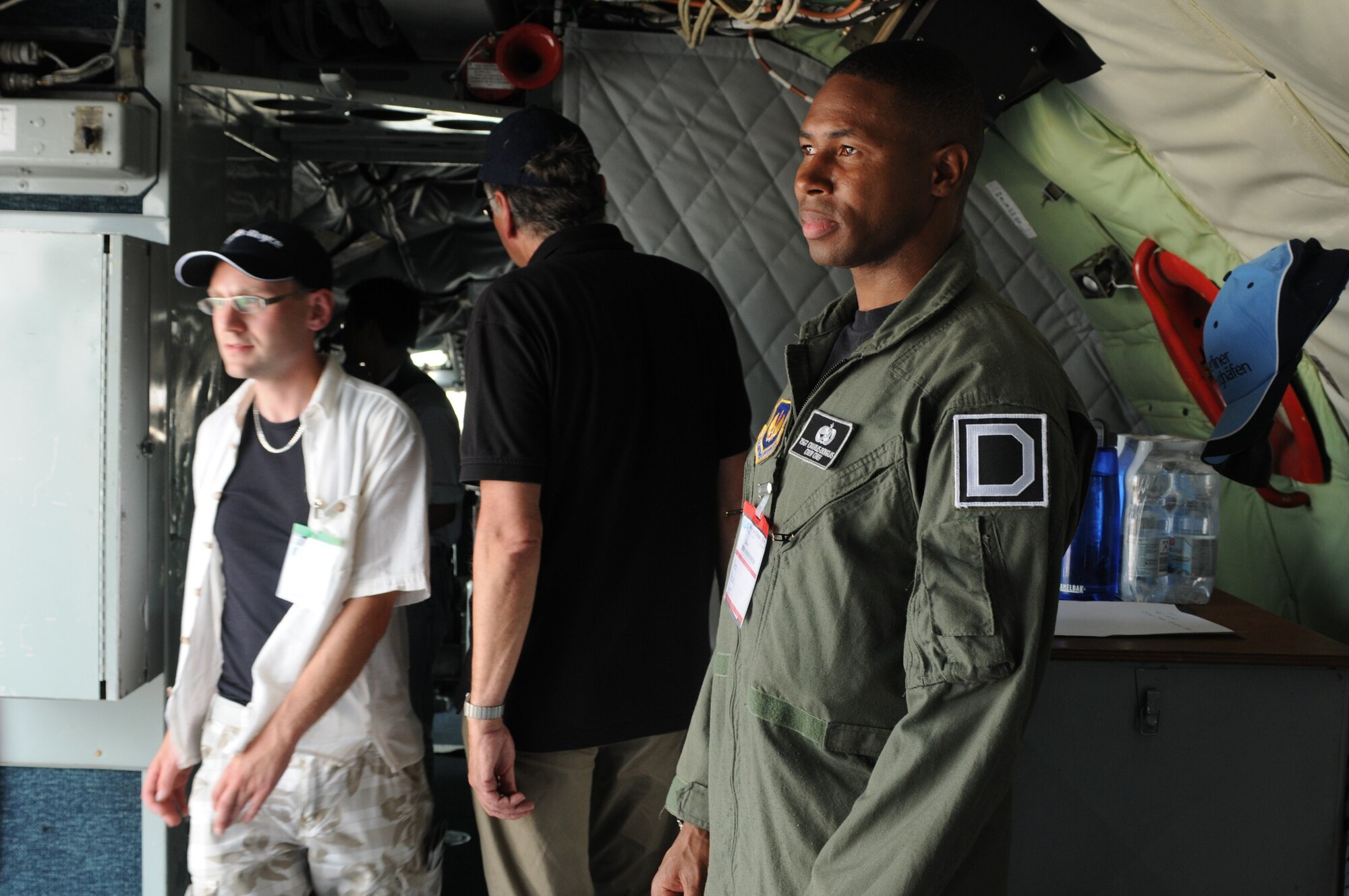 Tech. Sgt. Charles Douglas, 100th Aircraft Maintenance Squadron crew chief from Royal Air Force Mildenhall, United Kingdom, escorts people inside a KC-135 Stratotanker during the ILA 2010 Berlin International Aerospace Exhibition and Conferences June 10. The Berlin Air Show is one of the premier events of its type in the world, with 1,153 exhibitors from 47 countries, including the United States. (U.S. Air Force photo/Staff Sgt. Julius Delos Reyes)