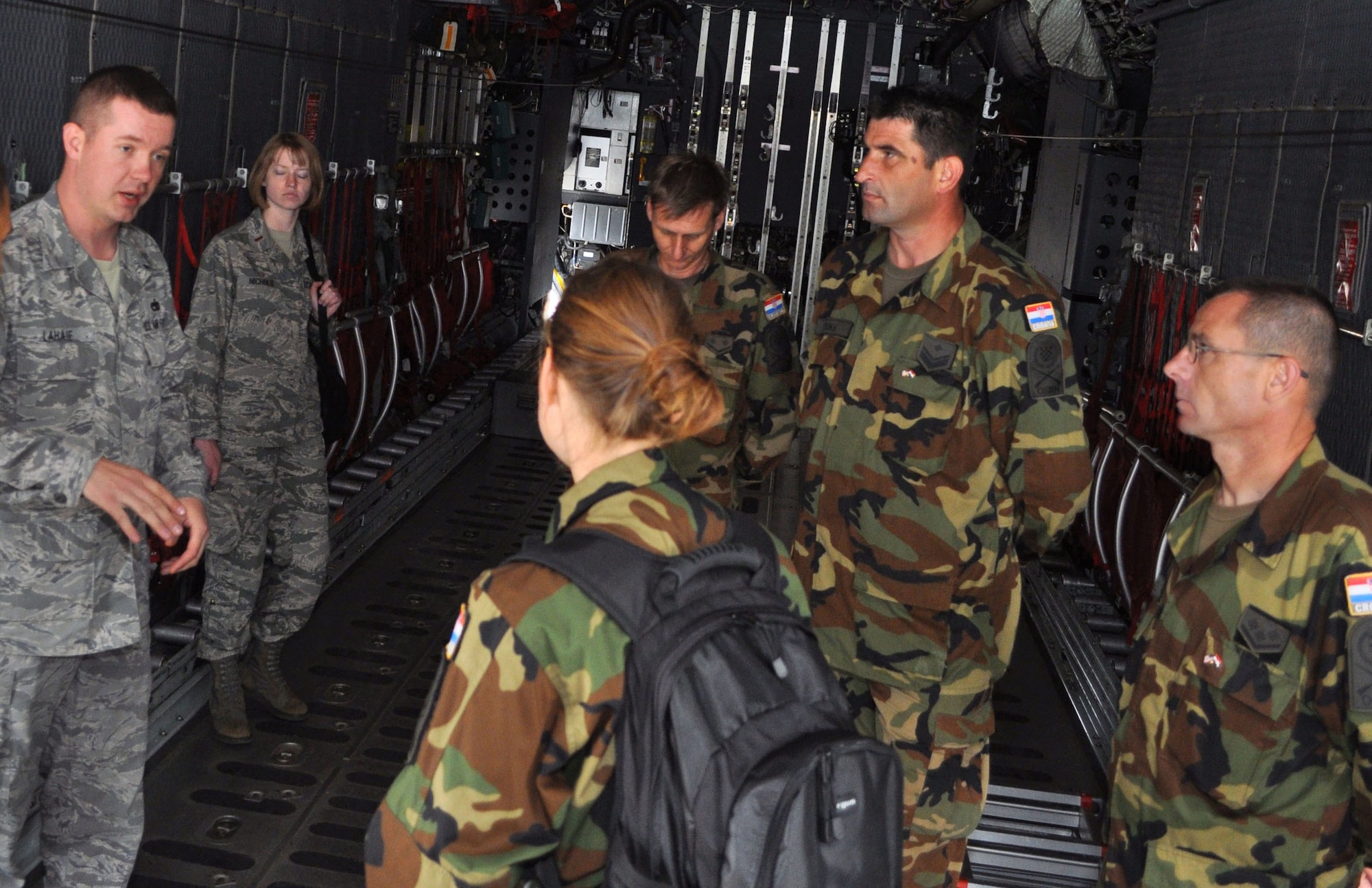 RAF MILDENHALL, England - Tech. Sgt. Robert Lahaie, 352nd Maintenance
Squadron, details the capabilities of the MC-130H Combat Talon II to members
of the Croatian Armed Forces as part of a tour during their visit with members
of the 100th Logistics Readiness Squadron here.  The five-member Croatian
team was here observing transportation, packing and handling operations in
an effort to assist them with standardizing these processes to fall in line
with United States and NATO standards.  (U.S. photo/Tech. Sgt. Marelise
Wood)  
