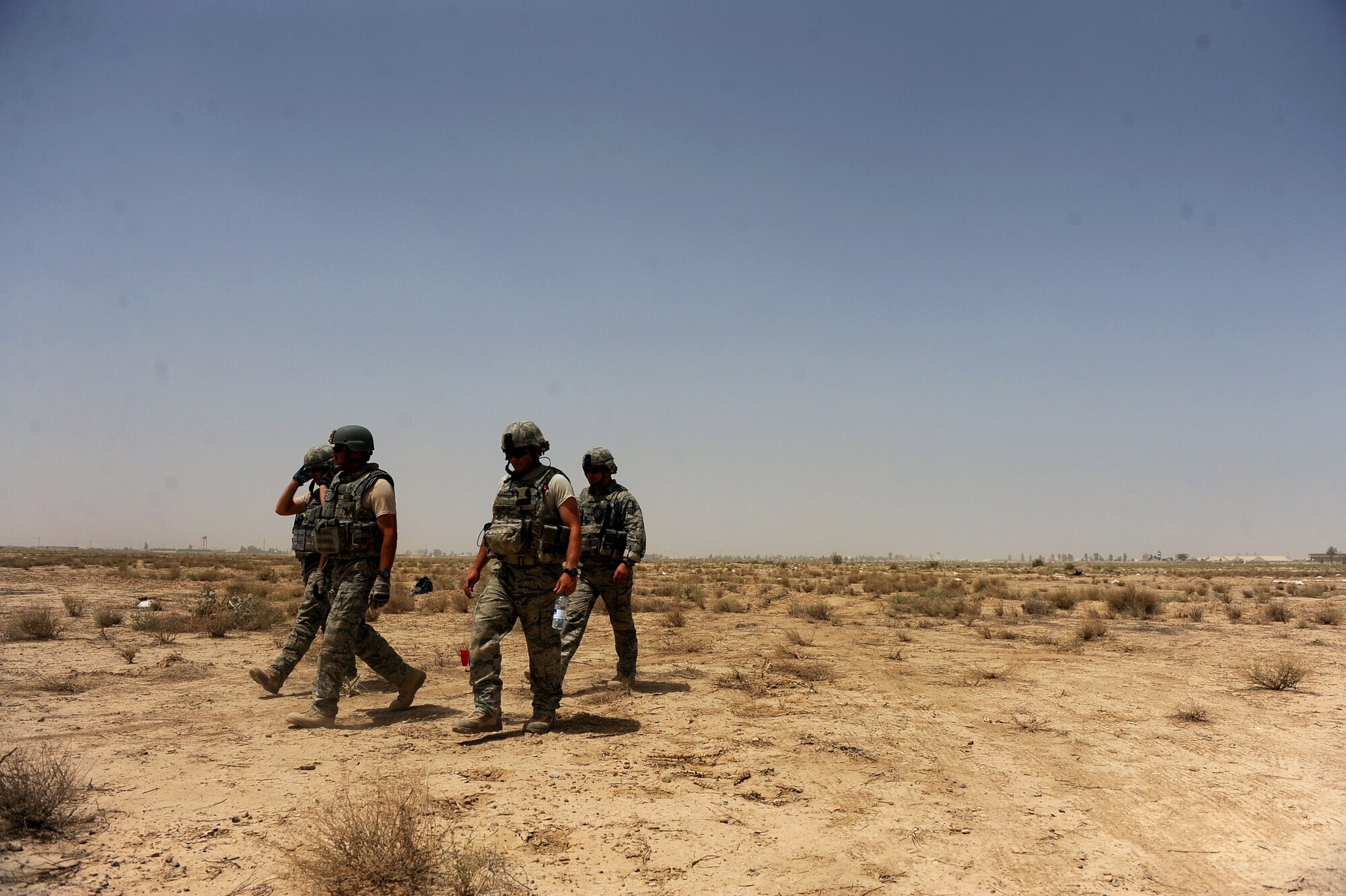 Explosive ordnance disposal technicians assigned to the 755th Air Expeditionary Squadron, Operating Location-Bravo EOD, finish placing charges for M-42 bomblets requiring destruction June 4, 2010, in Kandahar City, Afghanistan. (U.S. Air Force photo/Staff Sgt. Manuel J. Martinez/released)
