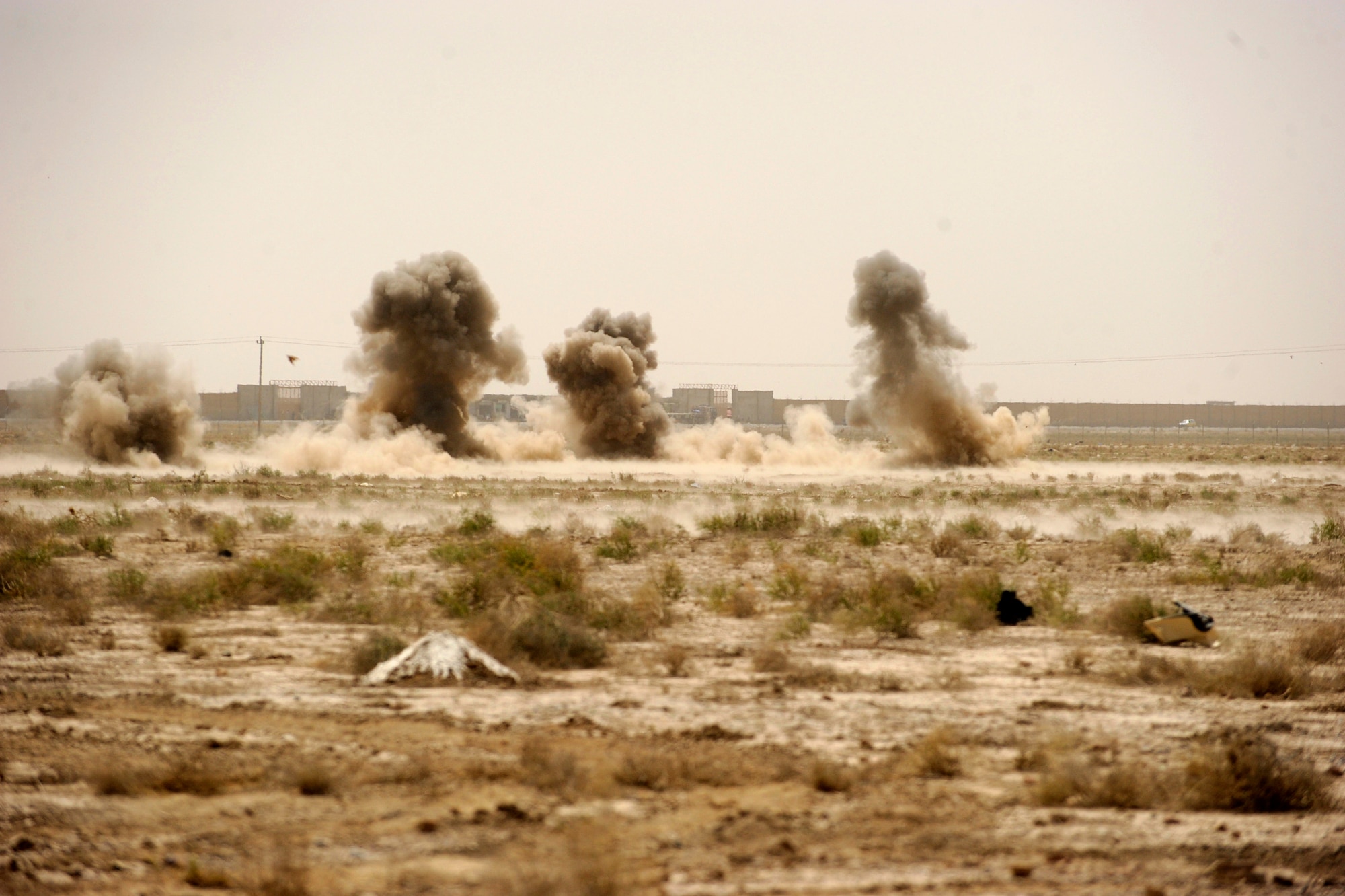Staff Sgt. Benjamin Stewart, not shown, an explosive ordnance disposal technician assigned to the 755th Air Expeditionary Squadron, Operating Location-Bravo EOD, detonates C-4 charges destroying M-42 bomblets littering a field June 4, 2010, in Kandahar City, Afghanistan. (U.S. Air Force photo/ Staff Sgt. Manuel J. Martinez/released)
