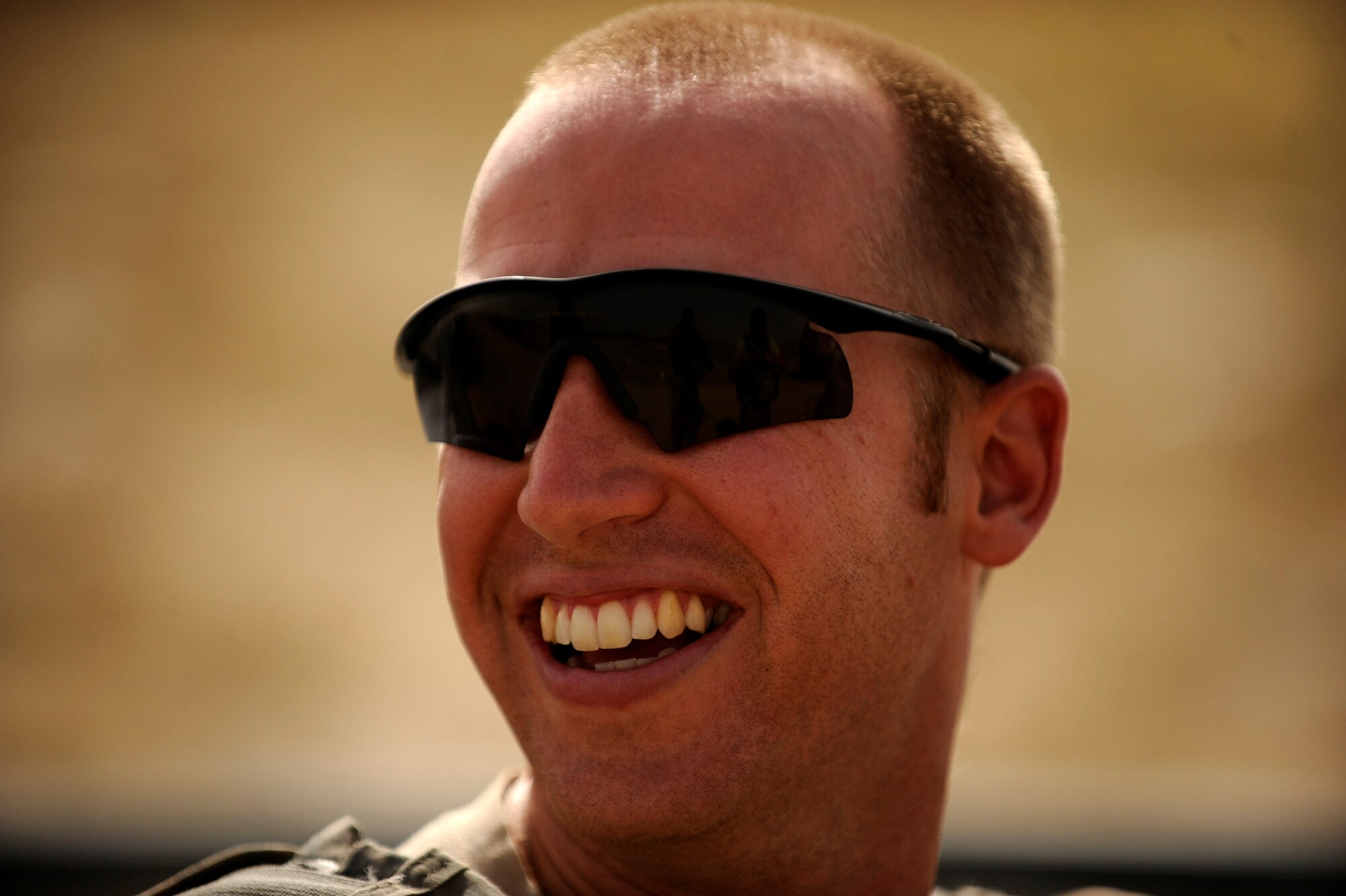 Capt. Andrew Clemmensen, an explosive ordnance disposal technician assigned to the 755th Air Expeditionary Squadron, Operating Location-Bravo EOD, talks with co-workers prior to clearing M-42 bomblets out of a field June 4, 2010, in Kandahar City, Afghanistan. (U.S. Air Force photo/ Staff Sgt. Manuel J. Martinez/released)
