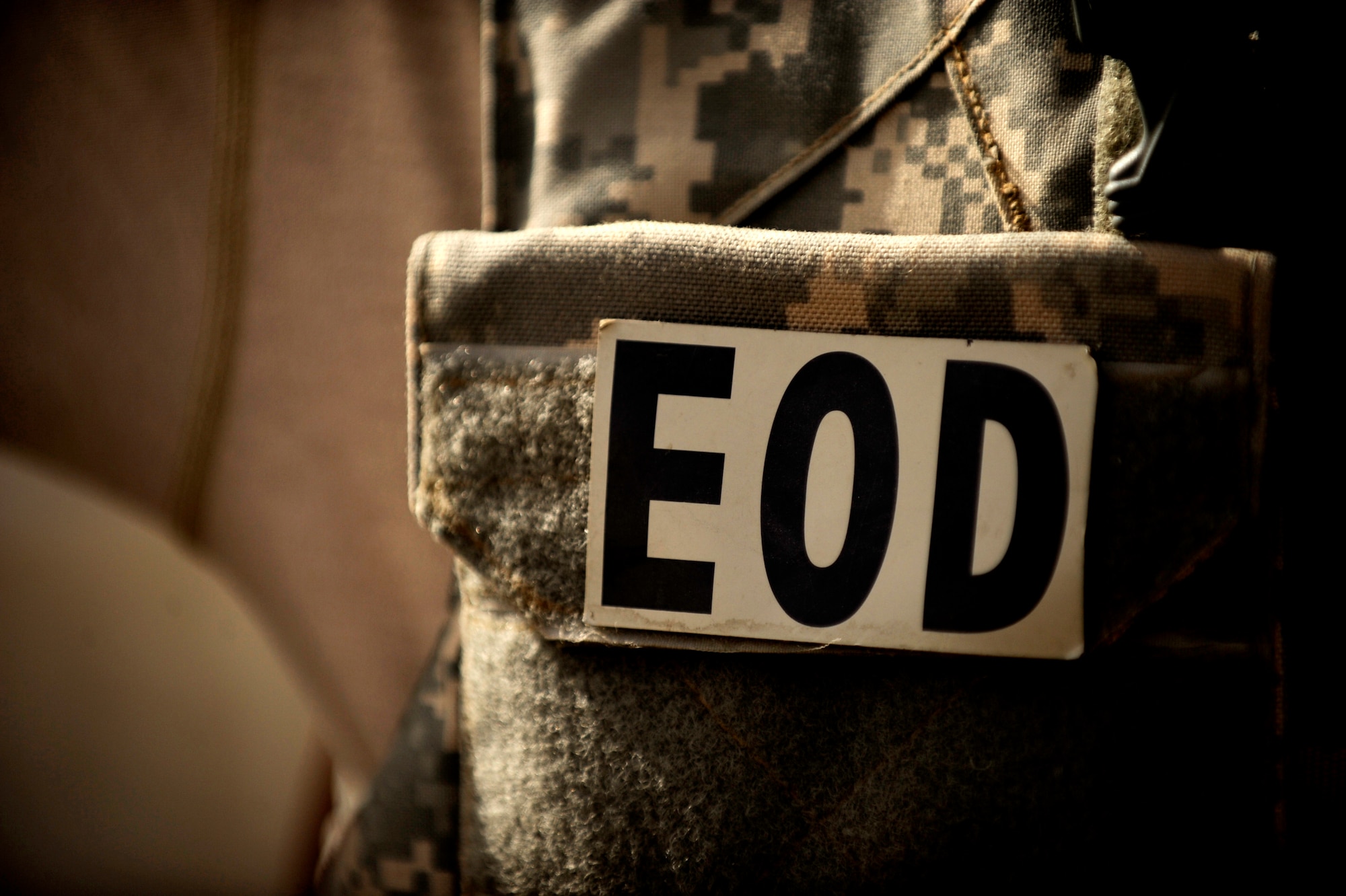 Master Sgt. Donald Moore, an explosive ordnance disposal technician assigned to the 755th Air Expeditionary Squadron, Operating Location-Bravo EOD, talks with co-workers prior to clearing M-42 bomblets out of a field June 4, 2010, in Kandahar City, Afghanistan. (U.S. Air Force photo/ Staff Sgt. Manuel J. Martinez/released)

