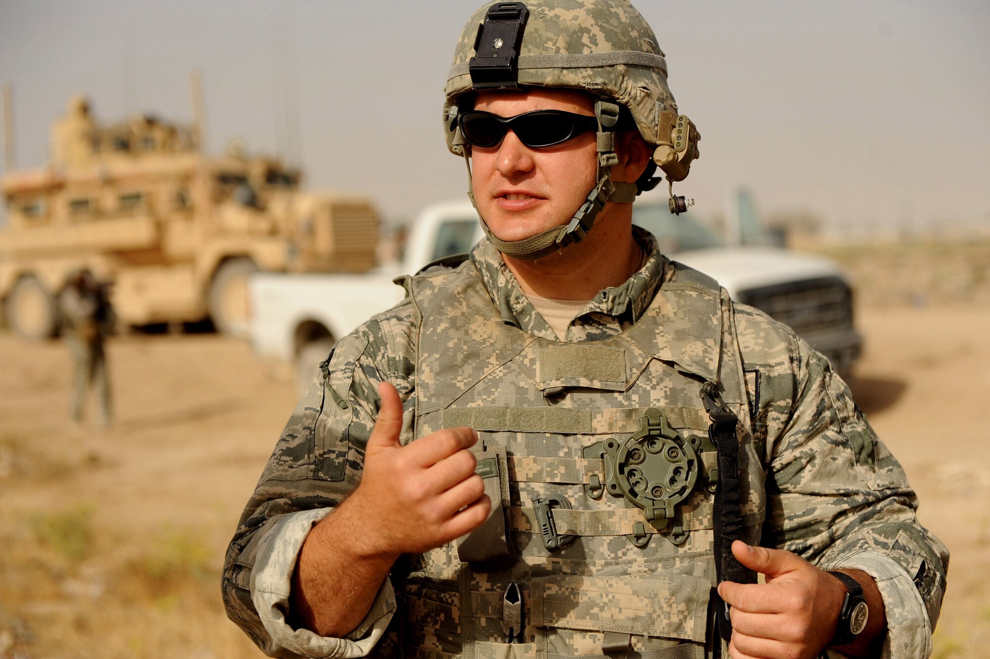 Tech. Sgt. David Niedzwiakdek an explosive ordnance disposal technician assigned to the 755th Air Expeditionary Squadron, Operating Location-Bravo EOD, talks about the day?s bomb clearing mission with Lee Thompson, an Environmental Chemical Corporation contractor, and about the location of uncovered M-42 bomblets they will destroy June 4, 2010, in Kandahar City, Afghanistan. (U.S. Air Force photo/ Staff Sgt. Manuel J. Martinez/released)
