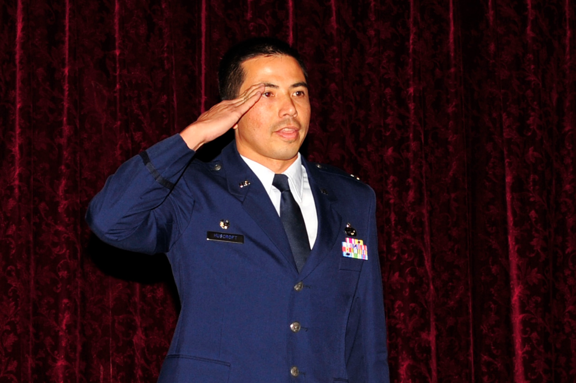 Lt. Col. Joseph Huscroft salutes his Airmen after assuming command of the 18th Component Maintenance Squadron during the change of command ceremony June 10. The 18th CMS provides maintenance on electronics for propulsion, avionics and airframe accessory sub-systems for all assigned aircraft. The squadron maintains the only four-bay engine test cell facility in Pacific Air Forces. Additionally, it is responsible for test, measurement and diagnostic equipment services for the wing and associate units, as well as maintenance services essential to daily aircraft sortie production and unit deployments. (U.S. Air Force photo/Senior Airman Amanda Grabiec)