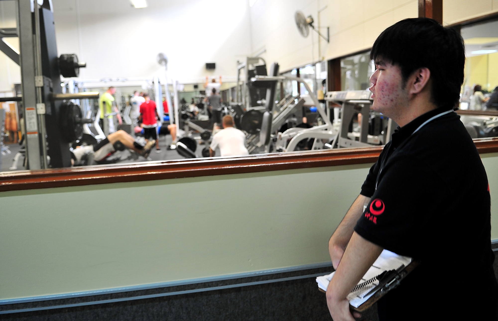 Ryo Oshiro conducts a head count of customers at the Risner Gym, June 10. Oshiro, who suffers from Marfanoid Hypermobility - a congenital defect syndrome that causes difficulty in using muscles to move parts of the body, belongs to an internship program from Kagamigaoka Special Education School. The local teen wrapped up his four-day internship at the Risner Fitness Center’s information desk June 11. (U.S. Air Force photo/Tech. Sgt. Rey Ramon) 