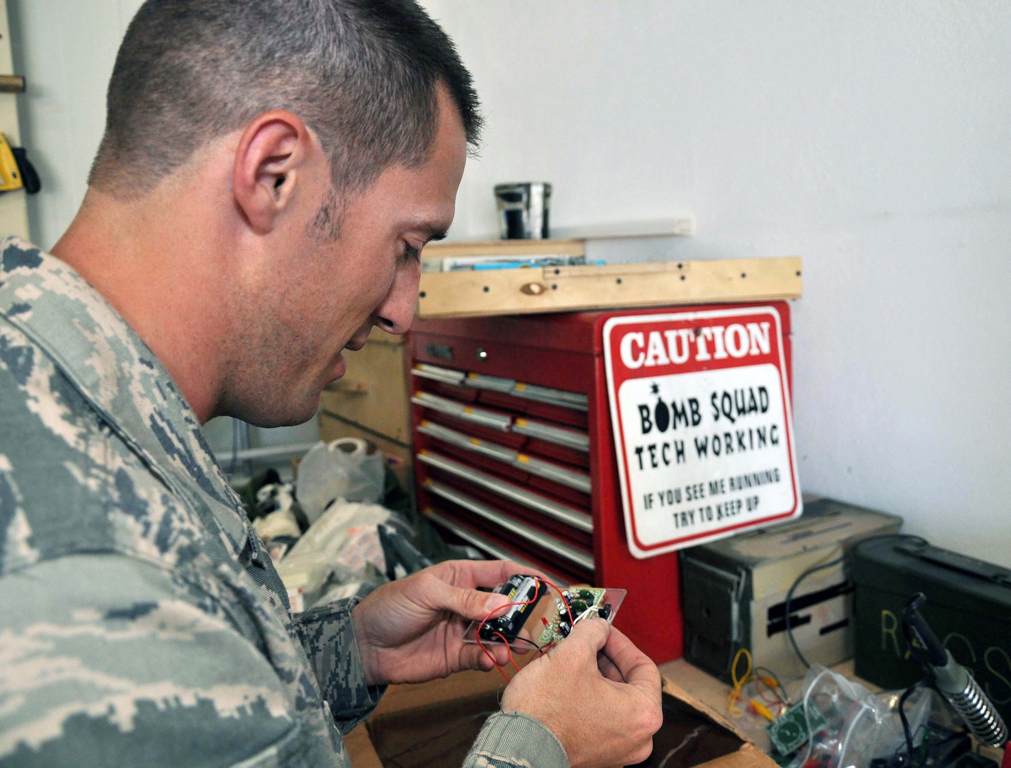 Staff Sgt James Bennett, an explosive ordnance disposal technician deployed to the Transit Center at Manas, Kyrgyzstan, creates an improvised explosive device for routine training May 14, 2010. As an EOD tech, Sergeant Bennett is on his third deployment. He was one of the first four EOD Airmen to earn an Army Combat Action Badge while deployed in 2006. (U.S. Air Force photo/Staff Sgt. Carolyn Viss)