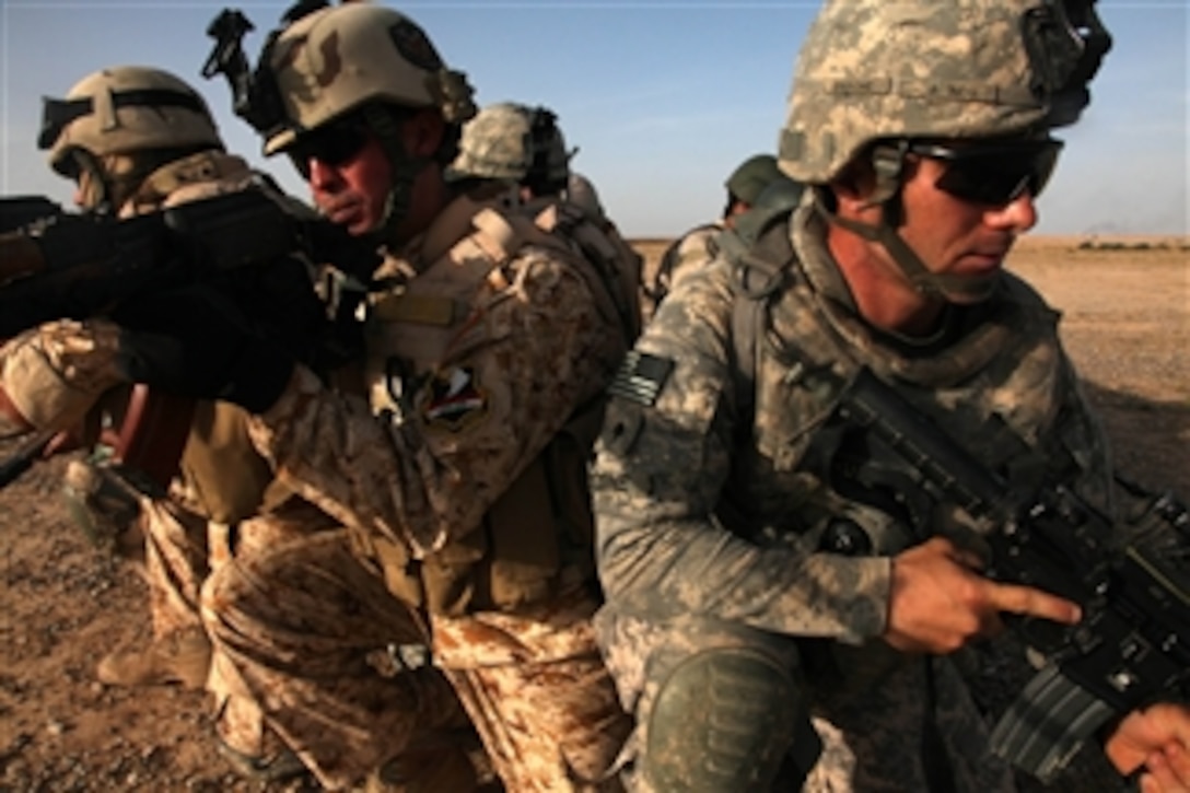 U.S. Army soldiers from Delta Company, 1st Battalion, 37th Armor Regiment, 1st Heavy Brigade Combat Team, 1st Armored Division and Iraqi soldiers from the 47th Iraqi Army Brigade train for an aerial reconnaissance force mission near Hawijah, Iraq, on May 22, 2010.  Iraqi soldiers with the team later led an ambush operation in the region.  