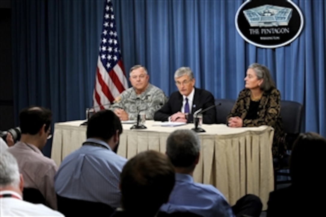 Secretary of the Army John M. McHugh (center) conducts a press conference in the Pentagon to announce changes in the leadership of Arlington National Cemetery on June 10, 2010.  