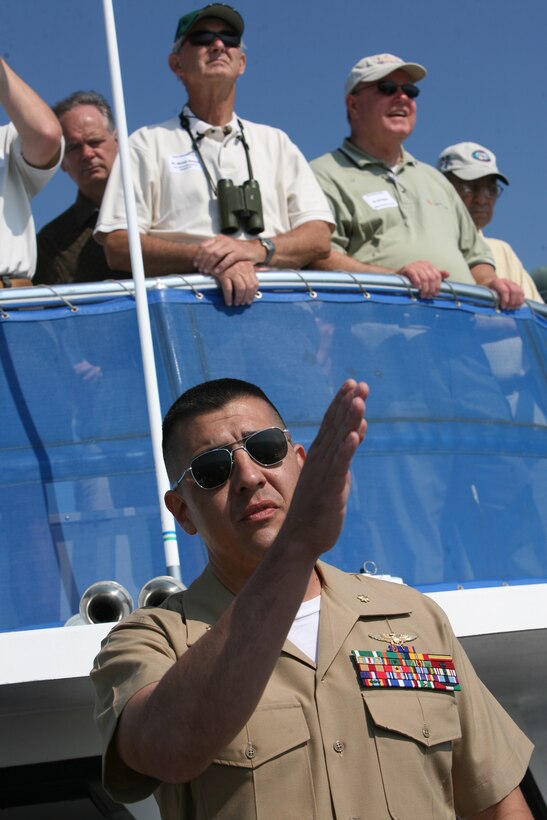 Maj. Carlos Scott, pilot with HMLA-467, offers an explanation of the uses of Bombing Target 11 range during a tour for local community members, June 12. Scott said having the range 15 minutes away from the air station provided his squadron with the crucial ability to train junior pilots.