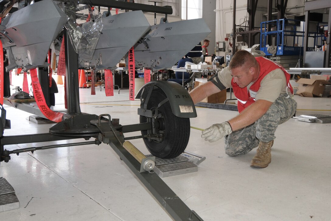 During Operation June Bug, in preparation for the Operational Readiness Inspection which will be in October, Staff Sgt. Nick Praska takes measurements of AGE equipment in the east hangar of the 132nd Fighter Wing in Des Moines, Iowa, on June 11, 2010.  (US Air Force photo/Staff Sgt. Linda E. Kephart)(Released)