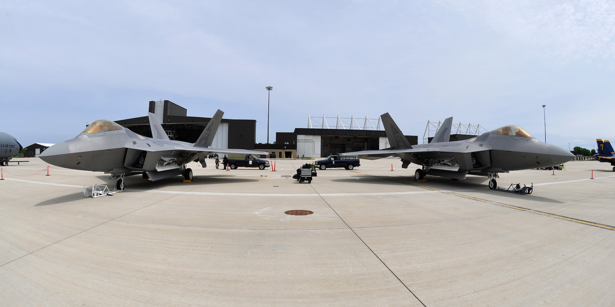 F-22 Raptors, assigned to the Air Force Aerial Demonstration Team at Langley Air Force Base, VA, stand by on the ramp of the 128th Air Refueling Wing, Gen. Mitchell International Airport, WI, on Thursday, June 10, 2010.  The Raptors participated in the 2010 Milwaukee Air and Water Show, which showcased the capabilities and skills of Air Force pilots and aircraft.  (U.S. Air Force photo by Staff Sgt. Jeremy Wilson / Released)