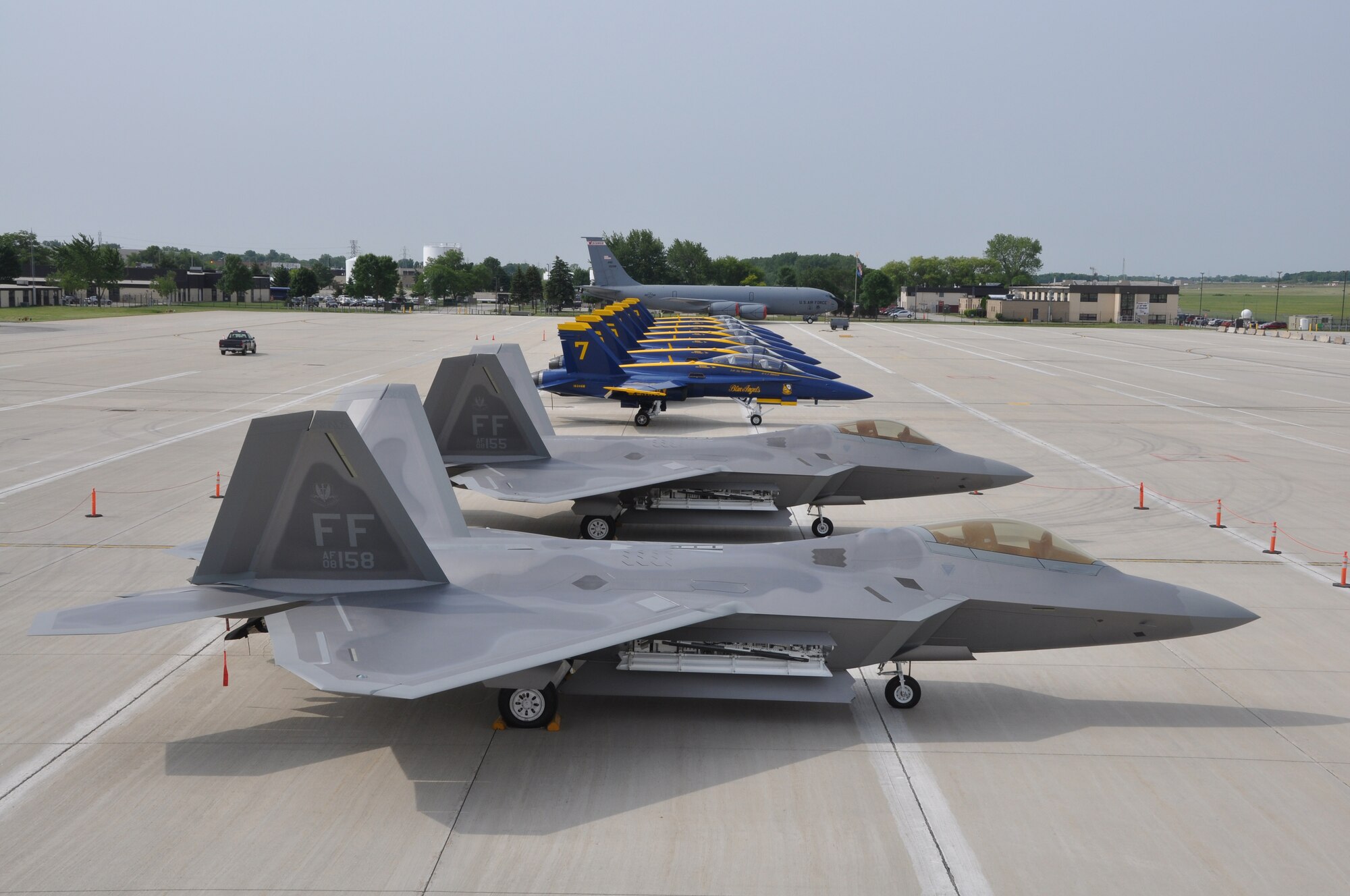 The Air Force F-22 Raptor Aerial Demonstration Team, Navy Blue Angels and an Air Force KC-135G Stratotanker sit on the ramp of the 128th Air Refueling Wing, Gen. Mitchell International Airport, Milwaukee, on Friday, June 11, 2010.  The aircraft participated in the 2010 Milwaukee Air and Water Show, showcasing the capabilities and superiority of U.S. military air assets by performing demonstrations near the Milwaukee shoreline.  The F-22 Raptors are stationed at Langley Air Force Base, VA; the Blue Angels are stationed at Pensacola Naval Air Station, FL; and the KC-135G Stratotanker is stationed at the 128th Air Refueling Wing.  (U.S. Air Force photo by Staff Sgt. Jeremy Wilson / Released)