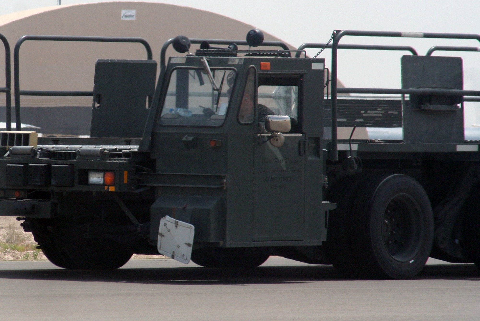 An air transportation Airman from the 380th Expeditionary Logistics Readiness Squadron's Air Terminal Operations Center drives a 60,000-pound-capable aircraft loader to unload a plane during operations for the 380th Air Expeditionary Wing at a non-disclosed base in Southwest Asia on  May 19, 2010. The 380th AEW supports operations Iraqi Freedom and Enduring Freedom and the Combined Joint Task Force-Horn of Africa. All air transportation Airmen deployed with the 380th AEW are deployed from the 89th Aerial Port Squadron at Joint Base Andrews, Md. (U.S. Air Force Photo/Master Sgt. Scott T. Sturkol/Released)