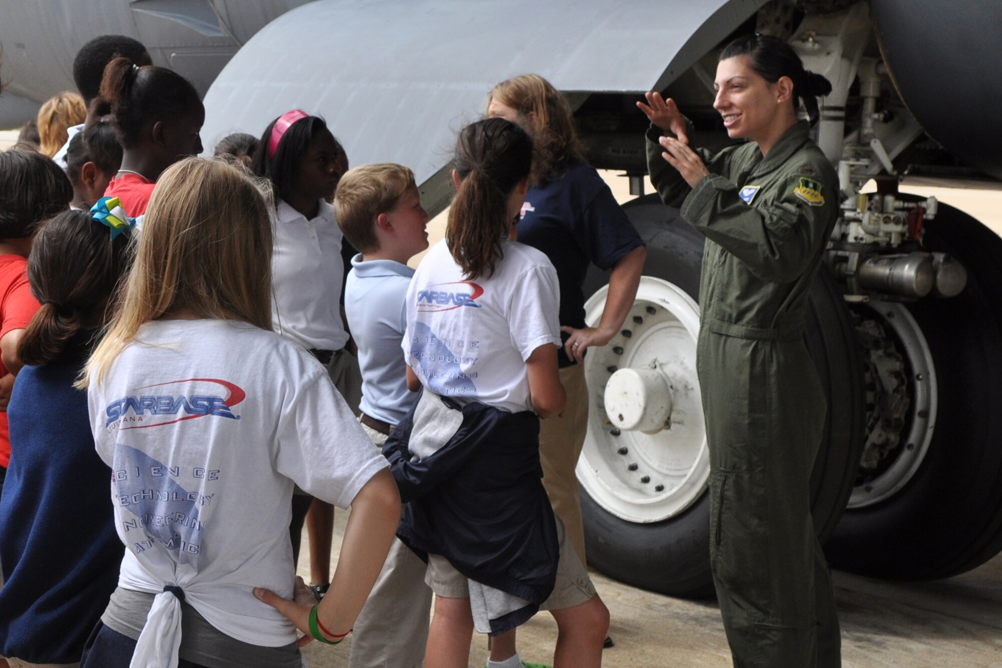 A group of fifth graders from Shreve Island Elementary School, Shreveport, La., listen closely as 2nd Lt. Amie Hacker briefs them on the history and capabilities of the B-52 Stratofortress on the ramp at Barksdale Air Force Base, La., June 10, 2010. These students comprise the last class of the school year from STARBASE Louisiana, to visit a B-52 at Barksdale. STARBASE Louisiana, one of 60 national STARBASE sites, is sponsored by the 917th Wing of the Air Force Reserve Command. The program presents an exciting 25-hour hands on/minds on aviation and aerospace curriculum to area 5th grade students and their teachers. Committed to addressing the critical needs in STEM education - Science, Technology, Engineering and Mathematics - STARBASE Louisiana introduces its students to exciting STEM education topics, inspiring these young minds to further explore these topics in future course work. Lieutenant Hacker is assigned to the 11th Bomb Squadron, but she is currently attending the B-52 formal training unit (FTU) at the 93rd Bomb Squadron, which is part of the 917th Wing at Barksdale. Lieutenant Hacker is a navigator student and claims Oklahoma City, Okla., as her hometown. She plans to transfer to Minot Air Force Base, N.D., after graduation. (U.S. Air Force photo/Tech. Sgt. Jeff Walston)  