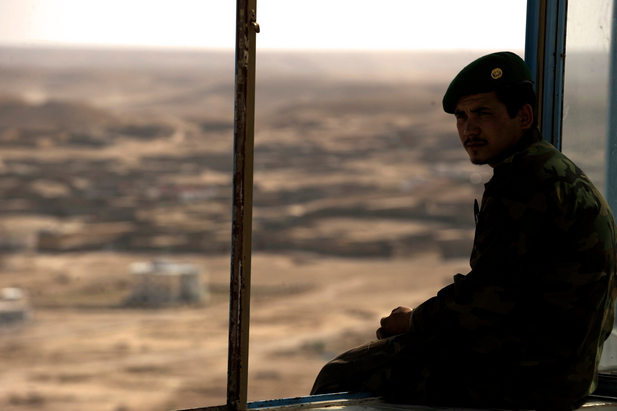 An Afghan National Army soldier sits in the teahouse at the highest point of ?The Castle? May 31, 2010, in Qalat City, Afghanistan.  (U.S. Air Force photo/Staff Sgt. Manuel J. Martinez/released) 

