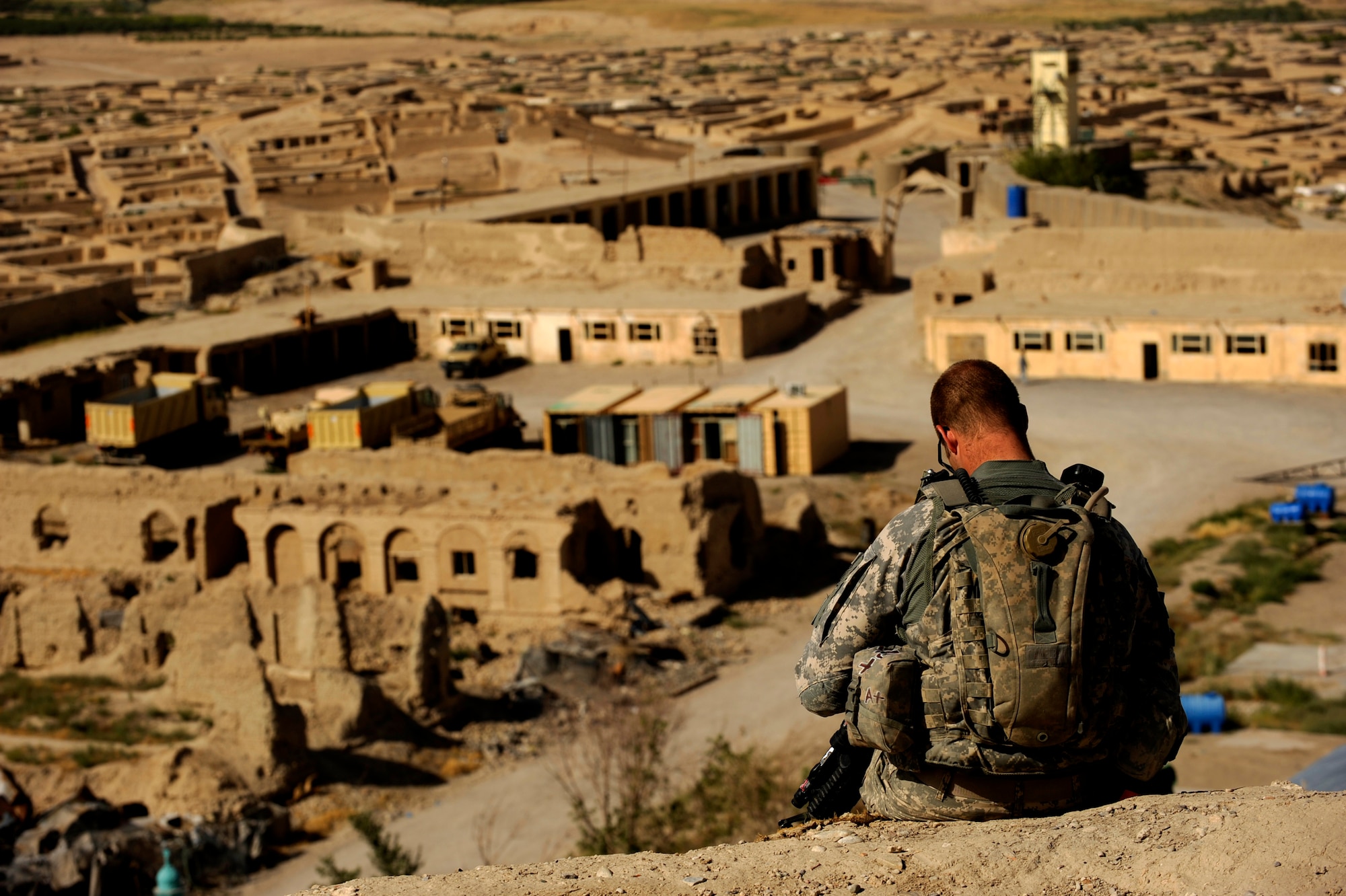 Army Sgt. Robert Crosier, a combat engineer assigned to Provincial Reconstruction Team Zabul, relaxes and enjoys the view of Qalat City from the highest part of ?The Castle? May 31, 2010, in Afghanistan.  (U.S. Air Force photo/Staff Sgt. Manuel J. Martinez/released) 
