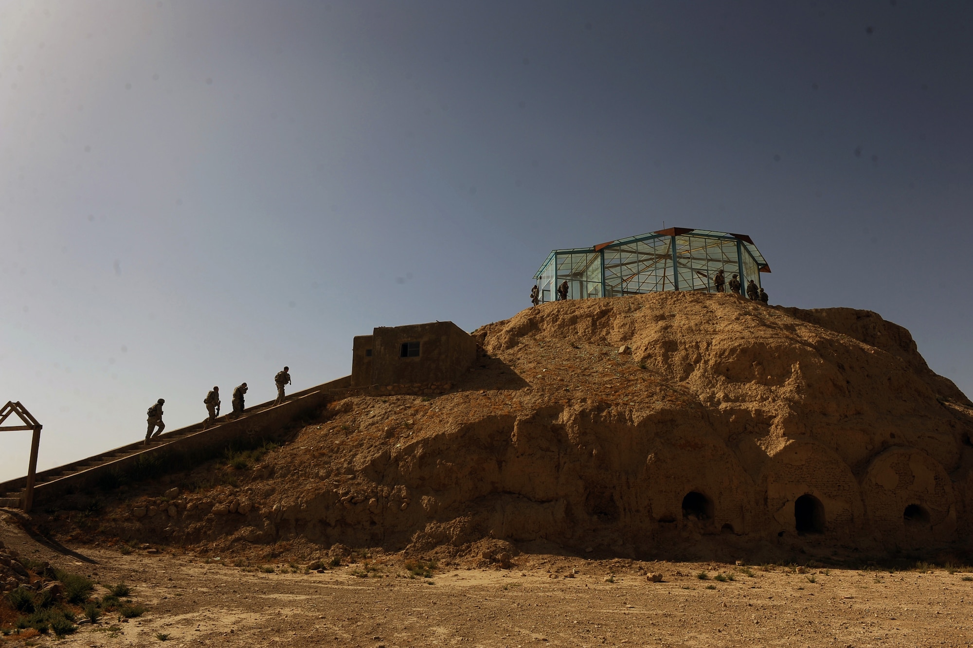 U.S. Soldiers from the security forces team assigned to Provincial Reconstruction Team Zabul, walk up a stair case to the teahouse, which sits on the highest part of ?The Castle? May 31, 2010, in Qalat City, Afghanistan. Team Zabul and Afghan government officials are working together, so that one day this can be a place tourists from all over the world can visit. (U.S. Air Force photo/Staff Sgt. Manuel J. Martinez/released) 

