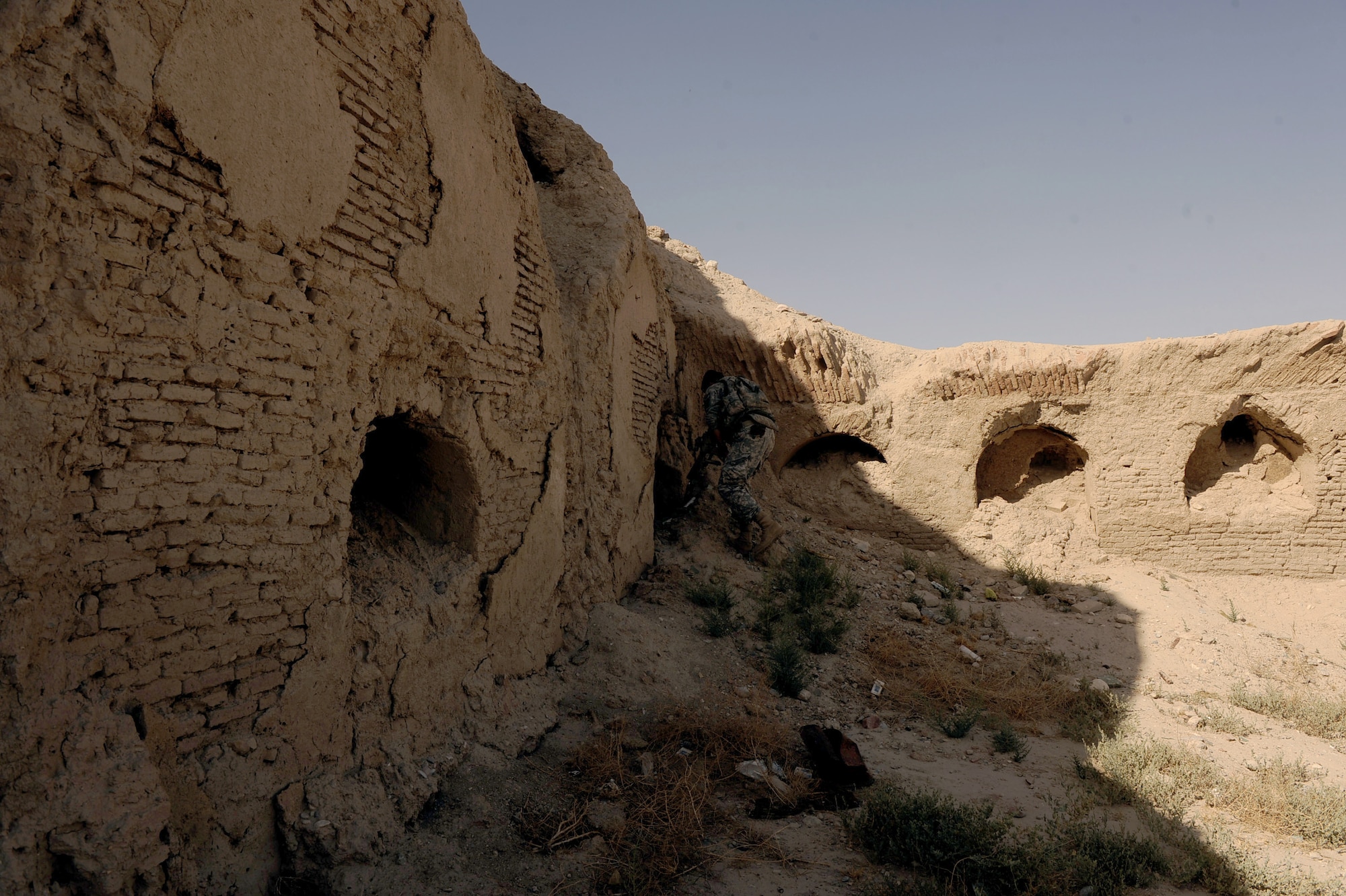 U.S. Soldiers from the security forces team assigned to Provincial Reconstruction Team Zabul, explore a short cave inside of ?The Castle? May 31, 2010, in Qalat City, Afghanistan. The former fortress of Alexander the Great is being utilized by Afghan National Army soldiers conducting operations throughout Zabul Province.  (U.S. Air Force photo/Staff Sgt. Manuel J. Martinez/released) 
