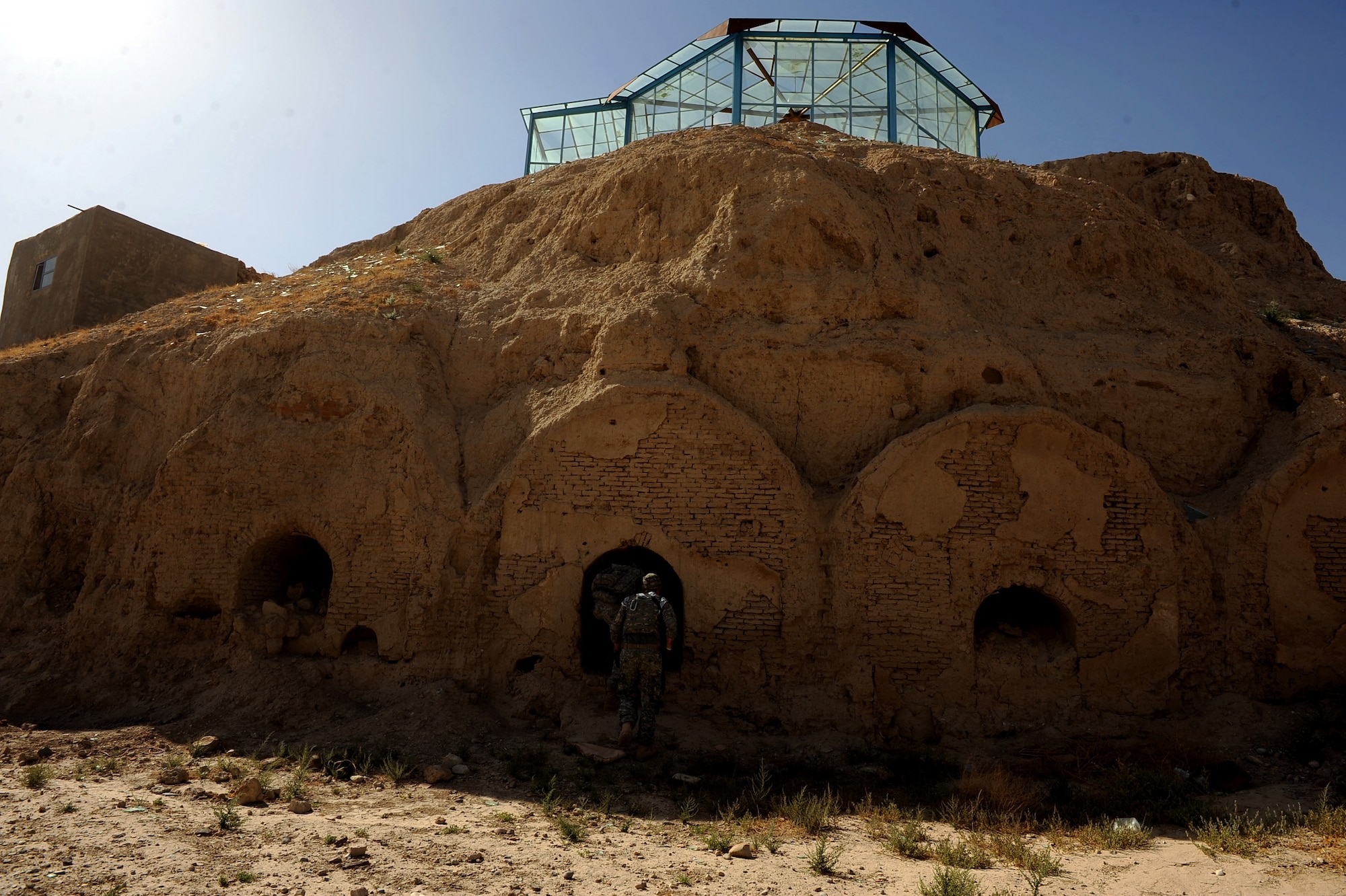 U.S. Soldiers from the security forces team assigned to Provincial Reconstruction Team Zabul, explore a short cave in a section of ?The Castle? May 31, 2010, in Qalat City, Afghanistan.  (U.S. Air Force photo/Staff Sgt. Manuel J. Martinez/released) 
