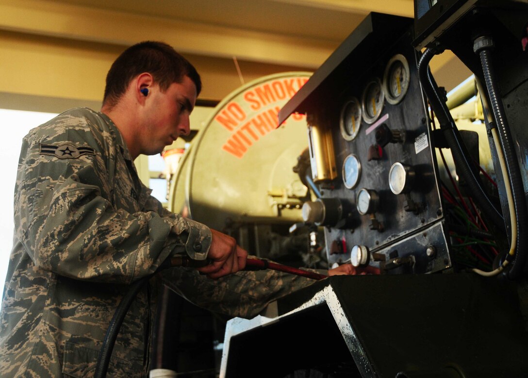 ANDERSEN AIR FORCE BASE, Guam - Airman 1st Class Dakota Ferris, a 36th Logistical Readiness Squadron vehicle maintenance technician, performs vehicle checks here June 9,. Airman Ferris was recognized as a 'Top Performer' by Master Sgt. Michael Schoenly, 36th LRS first sergeant. (U.S. Air Force photo by Airman 1st Class Jeffrey Schultze)