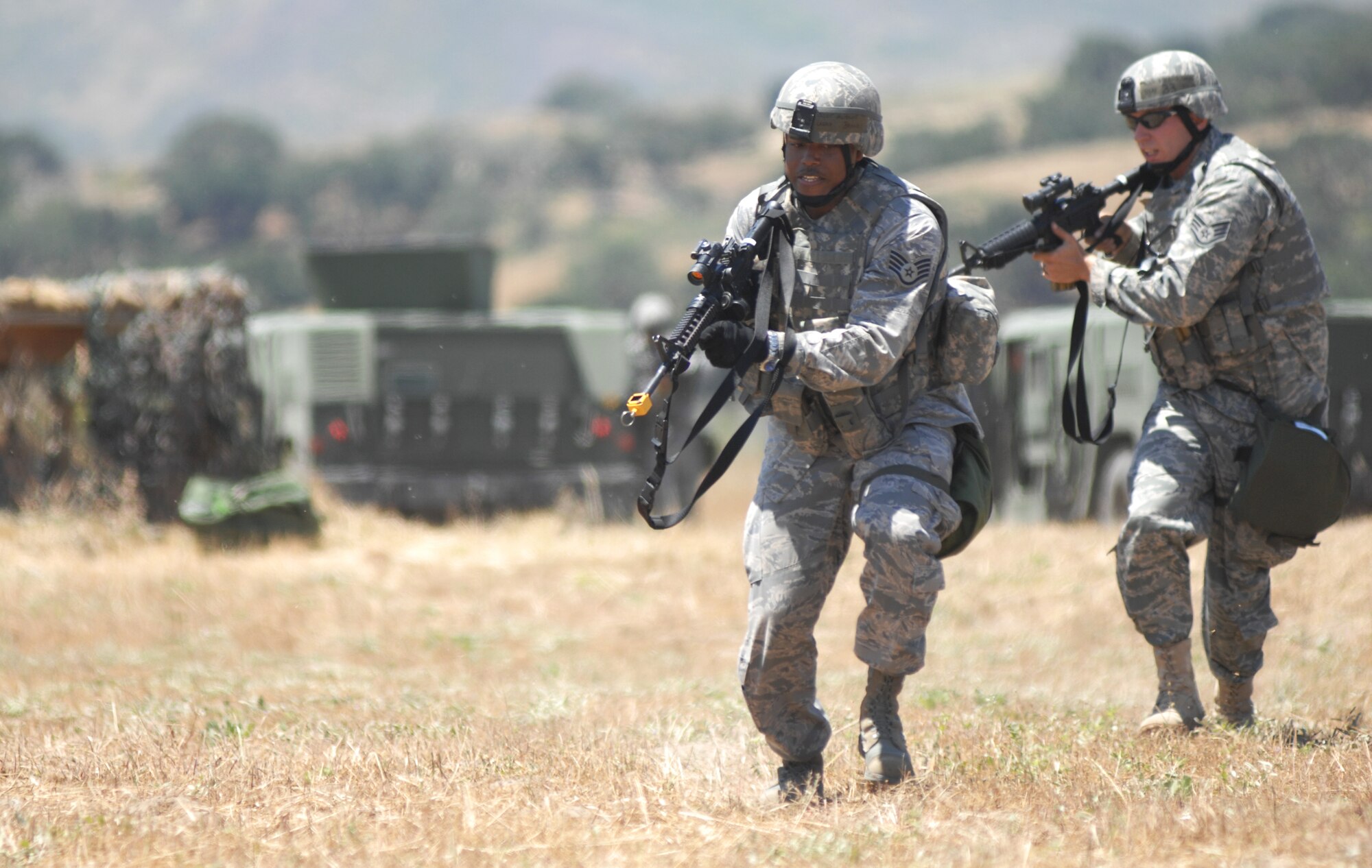 VANDENBERG AIR FORCE BASE, Calif. - Staff Sgt Antonio Brandy and Staff Sgt. Shawn Warwick, both of the 30th Security Forces Squadron, make their way to a defensive firing position during a simulated direct fire attack here Thursday, June 10, 2010. The North Star exercise tests airmen on reacting to indirect and direct fire. (U.S. Air Force photo/Senior Airman Christopher Hubenthal)


