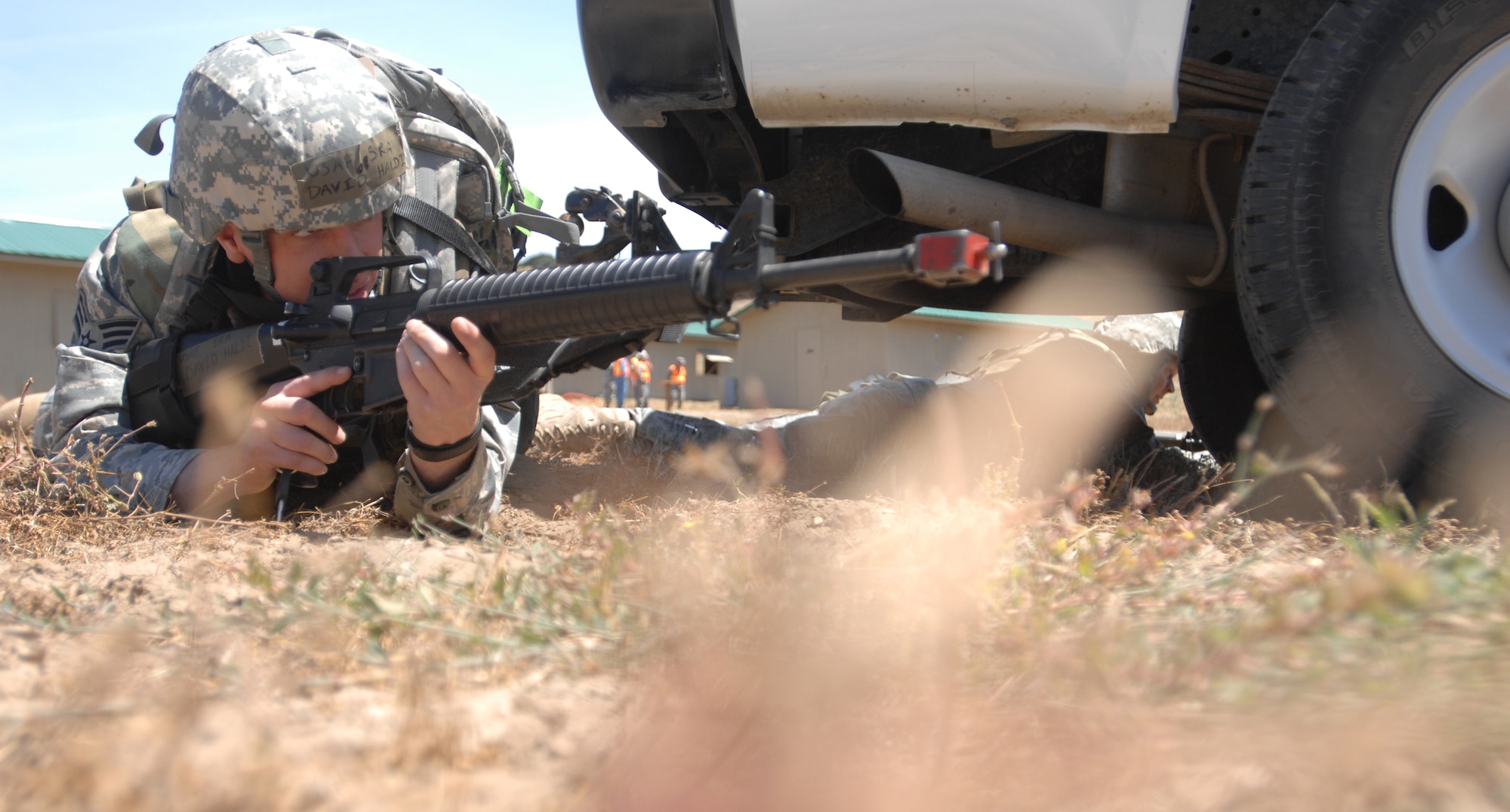 VANDENBERG AIR FORCE BASE, Calif. - Staring down his sight, Senior Airman David Haldi, of the 30th Logistics Readiness Squadron, reacts to the sound of gun shots during a North Star exercise here Thursday, June 10, 2010. North Star is an exercise that helps Vandenberg Airmen prepare for deployment taskings. (U.S. Air Force photo/Senior Airman Christopher Hubenthal)

