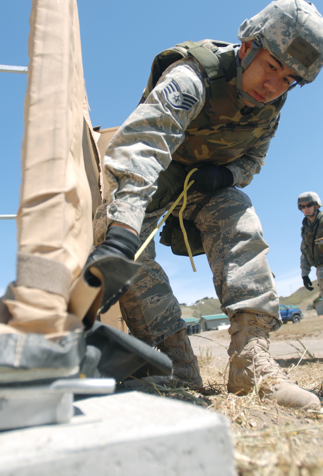 VANDENBERG AIR FORCE BASE, Calif. - Staff Sgt. Mercury Guemo, of the 30th Medical Support Squadron, tightens a rope to support a medical tent for the North Star exercise here Thursday, June 10, 2010. The medical tent is used for real world and exercise related emergencies. (U.S. Air Force photo/Senior Airman Christopher Hubenthal)

