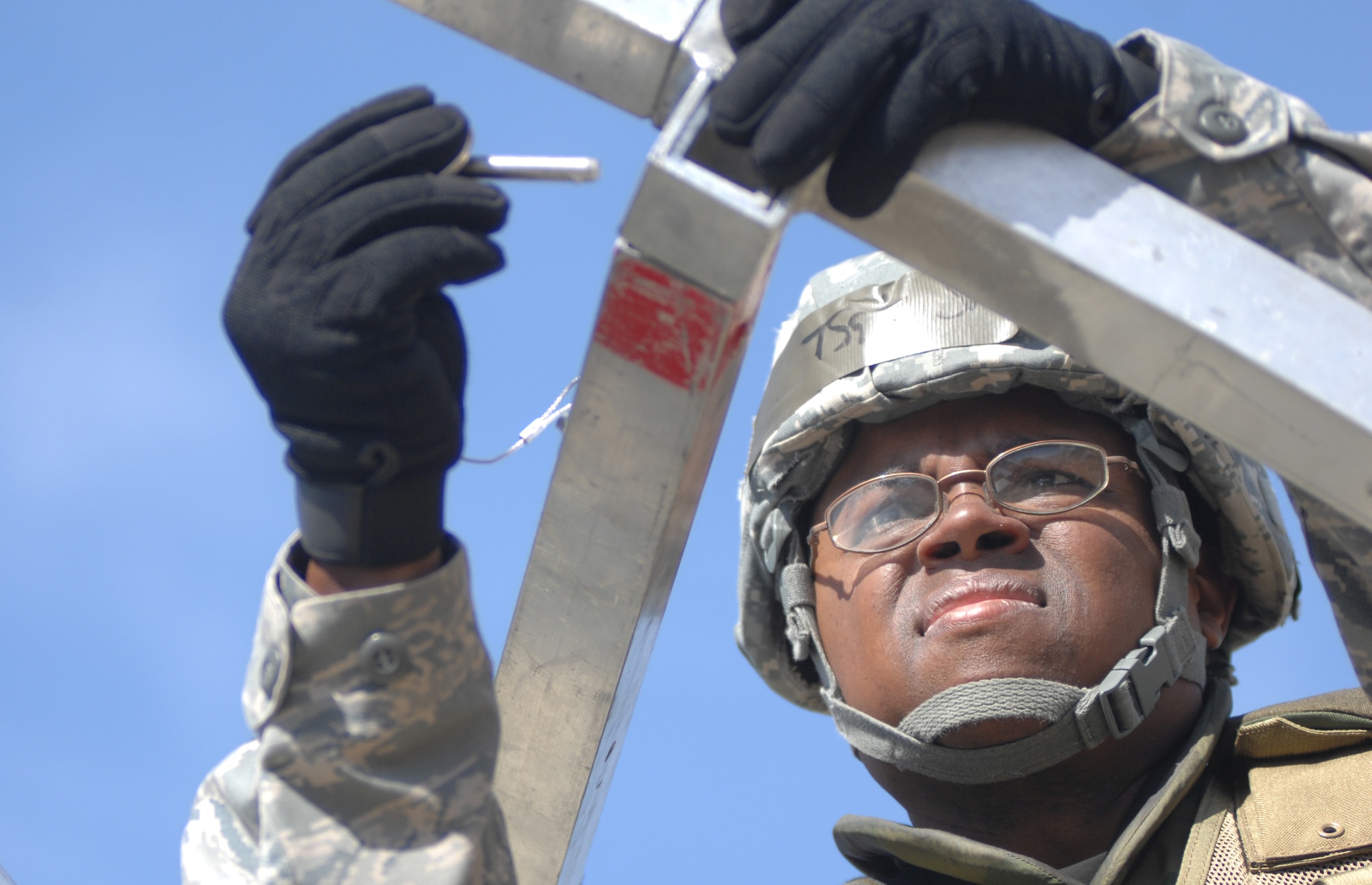 VANDENBERG AIR FORCE BASE, Calif. - Taking initiative, Tech. Sgt. David Smith, of the 30th Launch Group, helps construct the medical tent during the North Star exercise here Thursday, June 10, 2010. The North Star exercise prepares Airmen for real world situations and wartime contingencies. (U.S. Air Force photo/Senior Airman Christopher Hubenthal)

