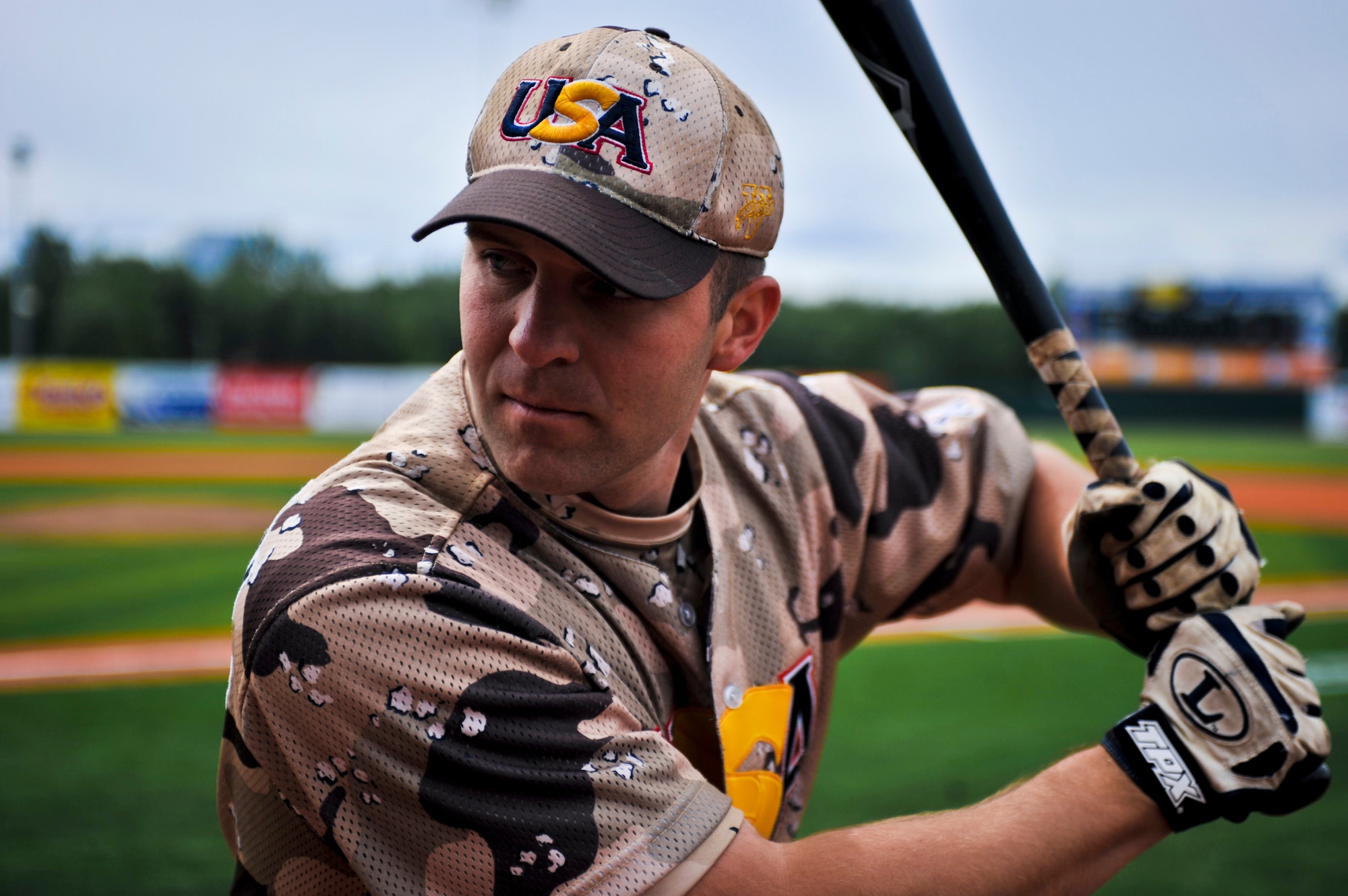 ANCHORAGE, Alaska – Chris Langley, first baseman for Heroes of the Diamond, warms up before the team plays the Anchorage Bucs, June 12. Mr. Langley is a captain and C-17 Globemaster III pilot for the 517th Airlift Squadron at Elmendorf Air Force Base, Alaska. The Heroes of the Diamond were established in 1990 as the Military All Stars. They are making their first stop in Alaska since being established and will play top local baseball teams on a 12-day tour which started June 12. (Air Force photo by Airman 1st Class Christopher Gross)