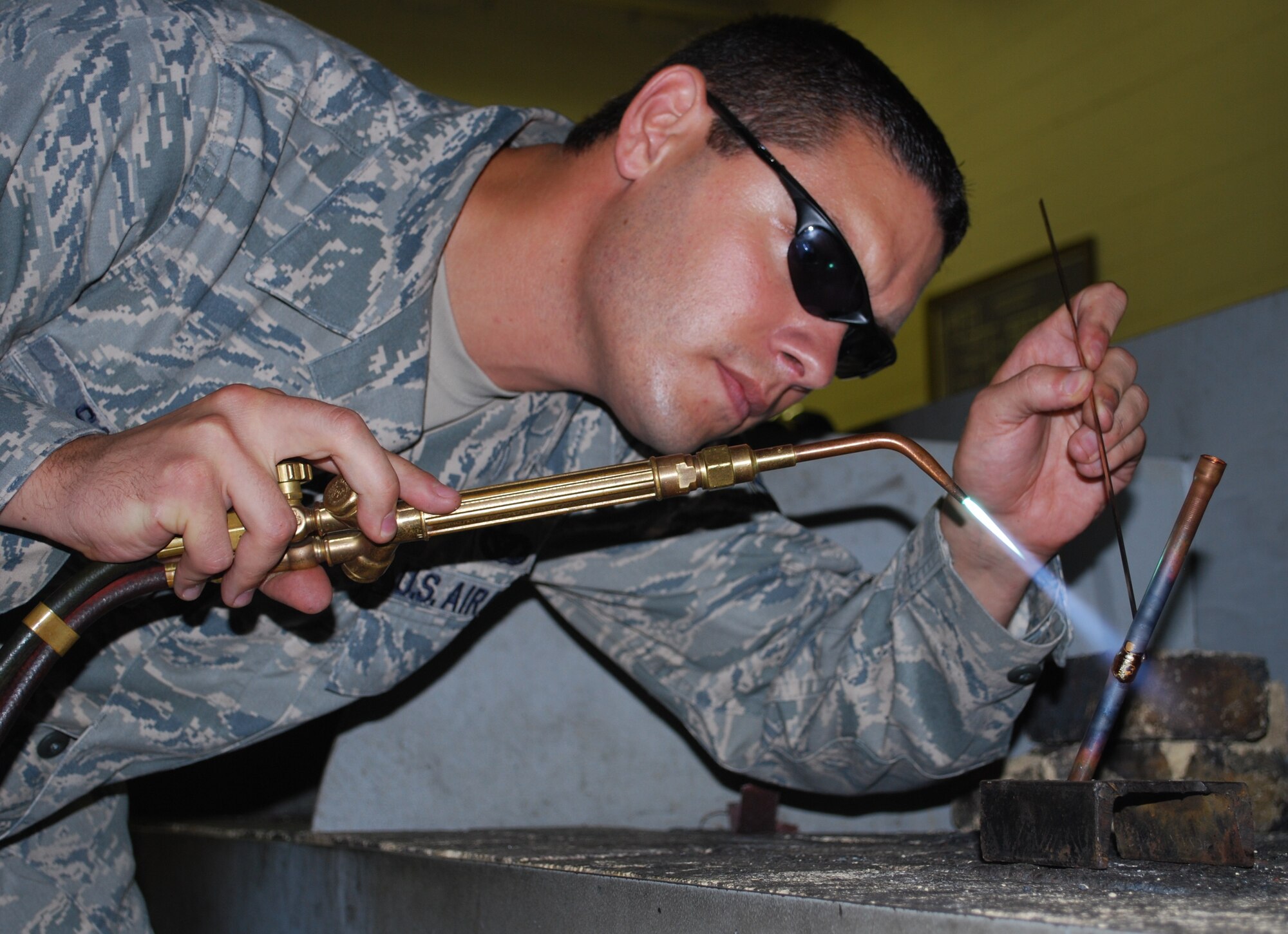 Tech. Sgt. Joshua Sacker, Heating, Ventilation, Air Conditioning and Refrigeration NCO in charge, demonstrates the proper use of brazing tools in an HVAC-R lab at Sheppard Air Force Base, Texas, June 10, 2010.  Sheppard’s 366th Training Squadron trains newly enlisted Airmen, HVAC technicians needing to be upgraded to 7-level and hosts the advanced HVAC-R course. (U.S. Air Force photo/Tech. Sgt. Vernon Cunningham)