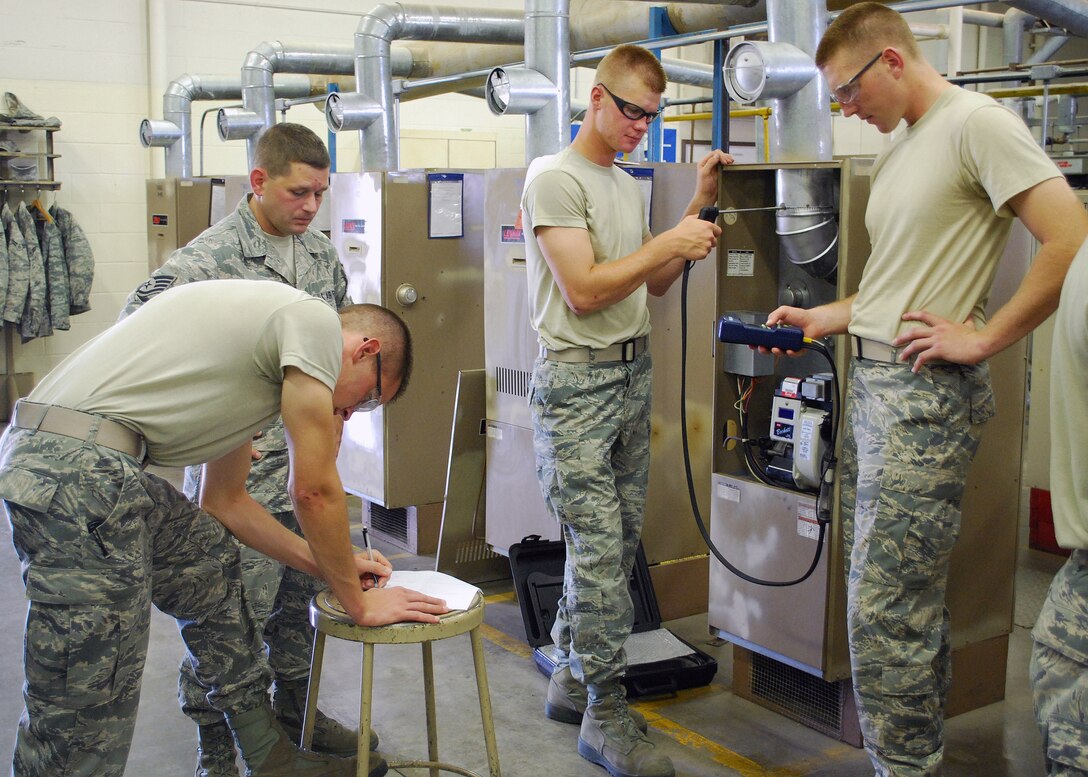 Students from the Heating, Ventilation, Air Conditioning and Refrigeration course test gas emissions from an air conditioning unit during their 20-week HVAC-R course at Sheppard Air Force Base, Texas, June 10, 2010.  During the course, HVAC-R students earn an Environmental Protection Agency certification so they may perform their duties in a manner safe for the environment. (U.S. Air Force photo/Tech. Sgt. Vernon Cunningham)