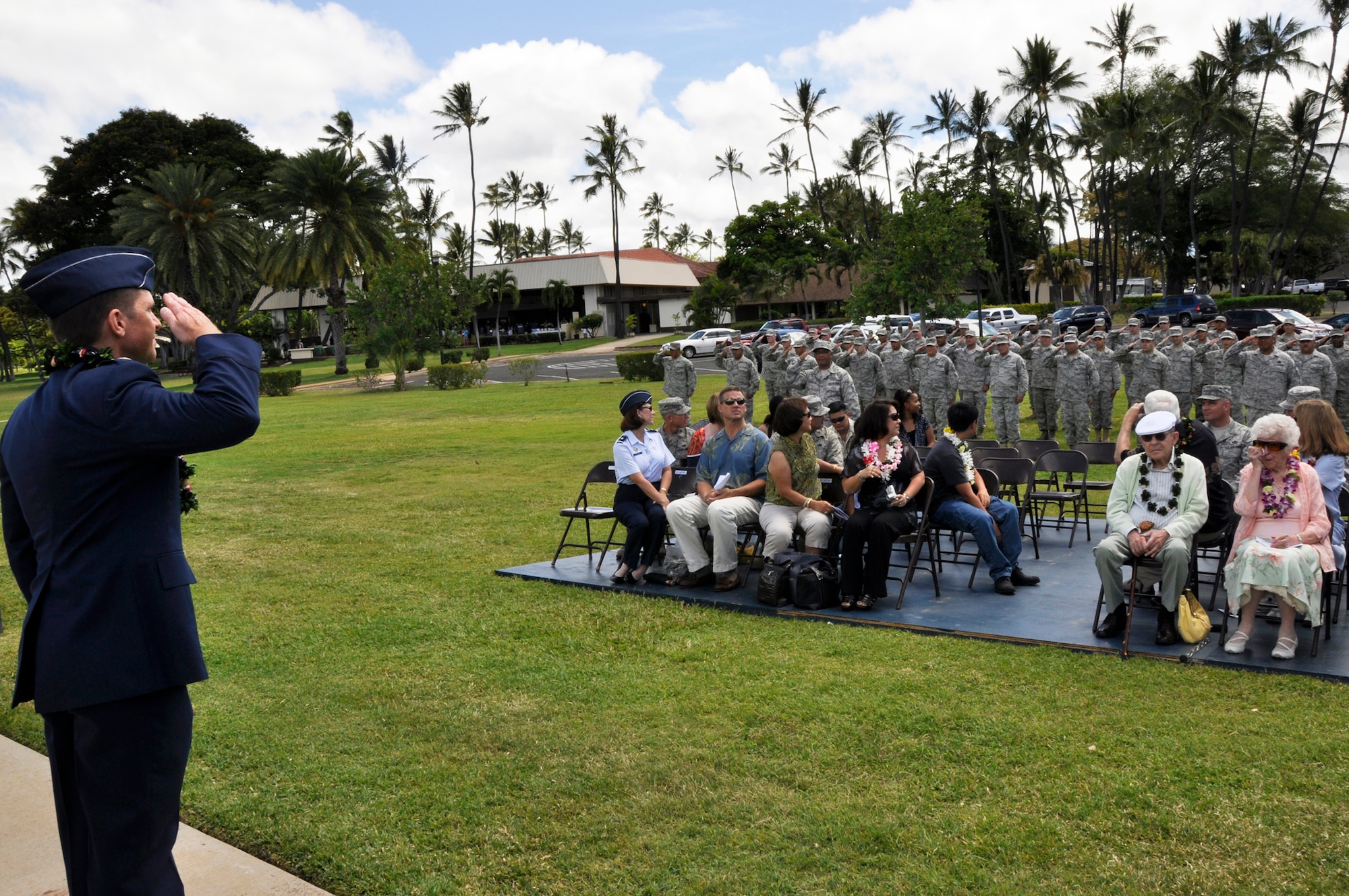 Members of the 48th Aerial Port Squadron render their first salute to in-coming commander Lt. Col. Eric Peebles after a change of command held at Aloha Aina Park, Joint Base Pearl Harbor Hickam, Hawaii, June 12, 2010. (U.S. Air Force photo/Master Sgt. Daniel Nathaniel III)