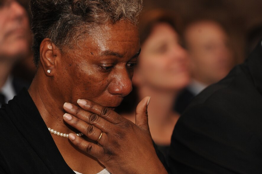 MOODY AIR FORCE BASE, Ga. --Fagella Farmer, mother of Staff Sgt. Stephanie Farmer, wipes a tear from her check during her daughter’s memorial service here June 11. The memorial service was held at Moody chapel for friends and family to give a final goodbye to Sergeant Farmer. (U.S. Air Force photo by Airman 1st Class Benjamin Wiseman/RELEASED)
