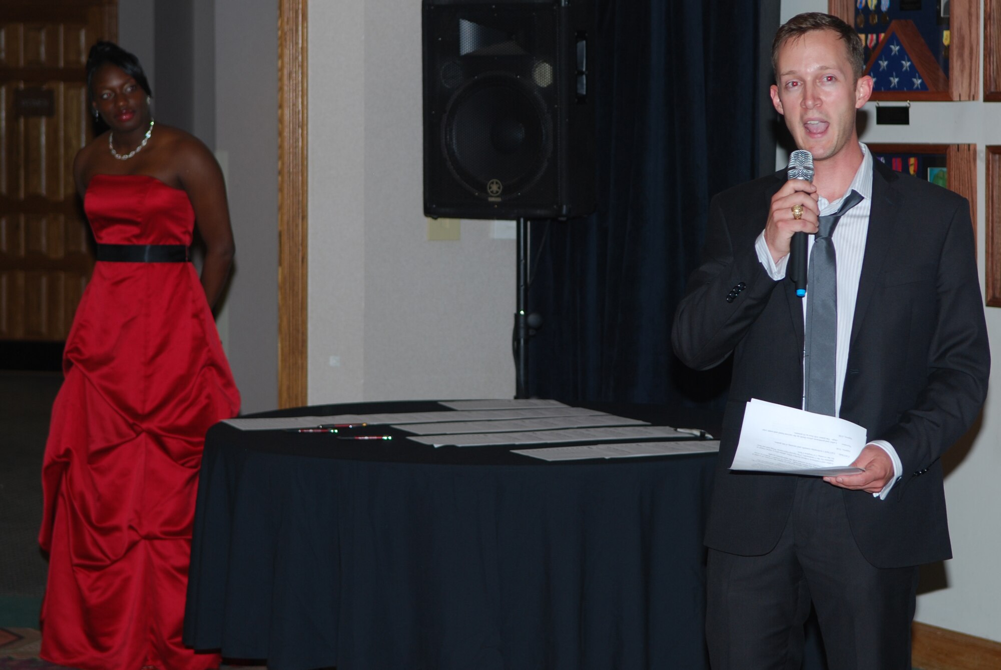 Capt. Jason Brown of the 27th Special Operations Communication Squadron, serves as master of ceremonies at the begining ot the Cannon Air Force Base Spring formal event June 12, 2010. The Spring Formal gave Cannon airmen and dependents the chance to dress up, have fun, and enjoy dancing and games. (US Air Force Photo by Master Sgt. Carlotta Holley) 