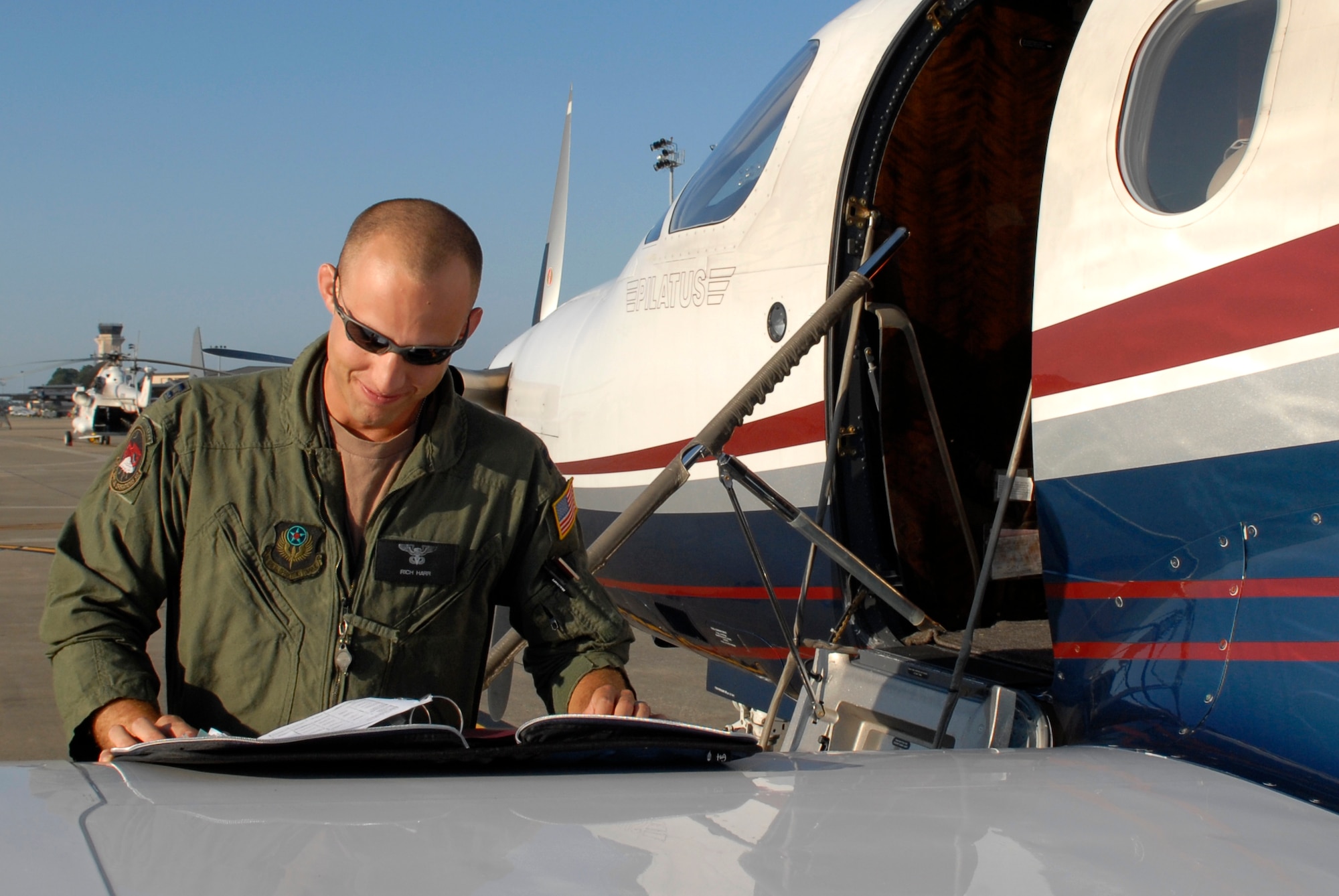 Capt Richard Harr, 34th Special Operations Squadron aircraft commander conducts a preflight check of a PC-12 aircraft June 11, 2010. Capt. Harr was selected for this week's "Tip of the Spear" spotlight. (DoD photo by Air Force Senior Airman Ryan Whitney)