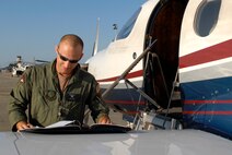 Capt Richard Harr, 34th Special Operations Squadron aircraft commander conducts a preflight check of a PC-12 aircraft June 11, 2010. Capt. Harr was selected for this week's "Tip of the Spear" spotlight. (DoD photo by Air Force Senior Airman Ryan Whitney)