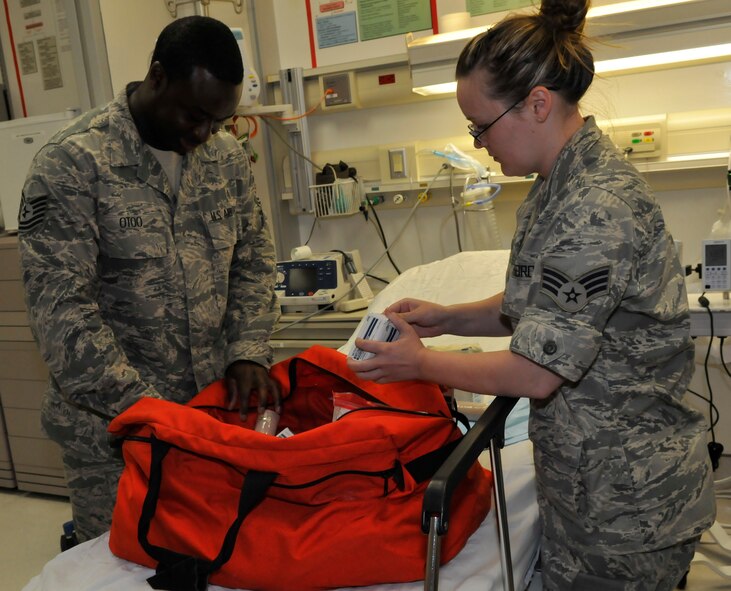 JOINT BASE ANDREWS, MD. – Senior Airman Hannah Poe and Tech. Sgt. Eric Otoo, from the 779th Medical Wing, prepare a hurricane emergency kit. (U.S. Air Force photo by Public Affairs Officer Melanie Moore)