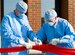 LANGLEY AIR FORCE BASE, Va. -- Col. Donald Kirkland, 633d Air Base Wing commander, and Col. Eric Stone, 633d Medical Group commander, cut the ribbon “Med Group-style”  in front of the new Langley Hospital wing June 14. The ceremony marked a milestone in the hospital renovation with the ribbon cutting and tour of the newly opened sections.  (U.S. Air Force photo/Senior Airman Zachary Wolf)
