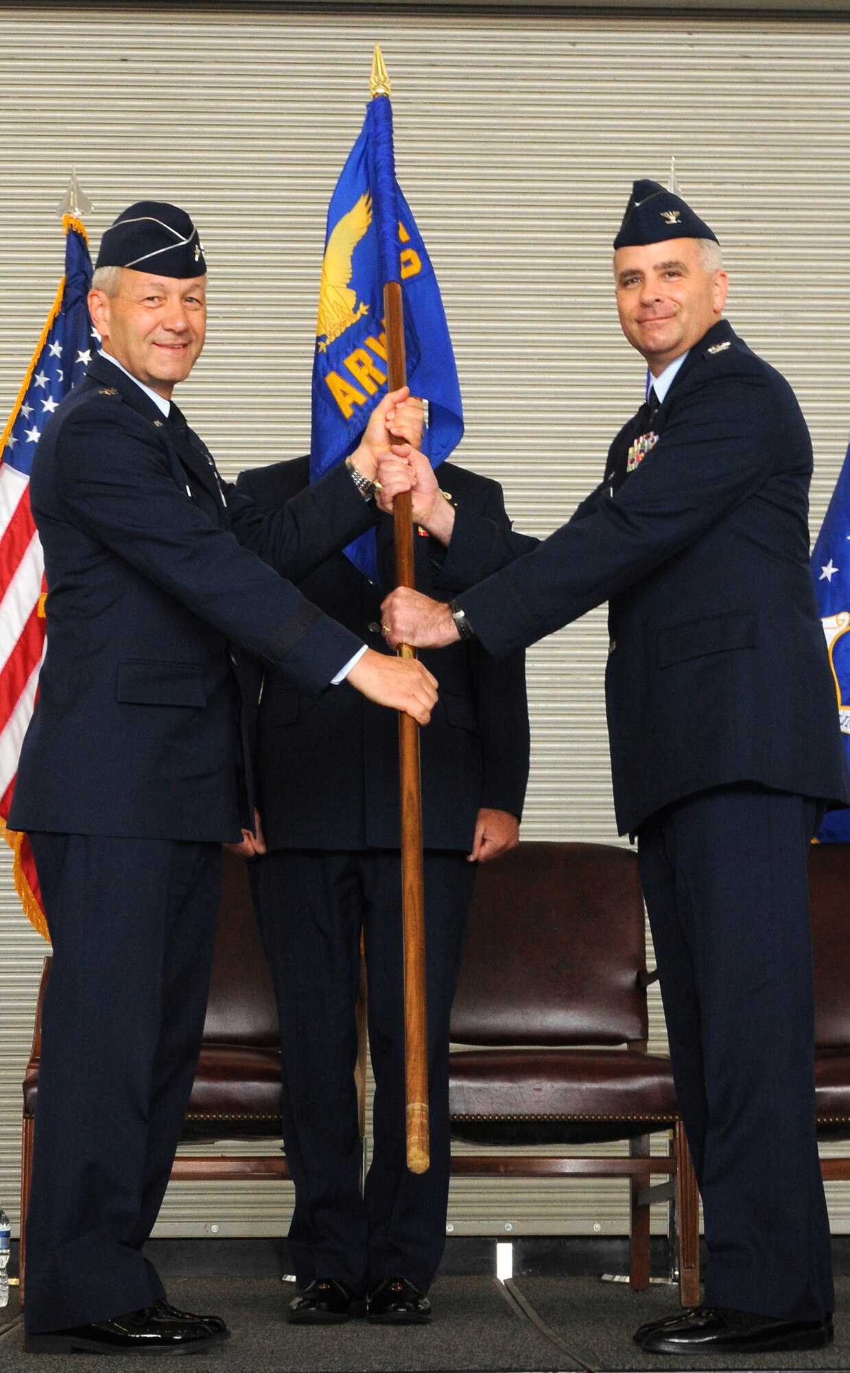 Col. James "Mike" Allman (right) assumes command of the 459th Air Refueling Wing in a change of command ceremony here June 13. Fourth Air Force commander, Maj. Gen. Eric W. Crabtree, served as the officiating officer for the event. (U.S. Air Force photo/Staff Sgt. Steve Lewis)