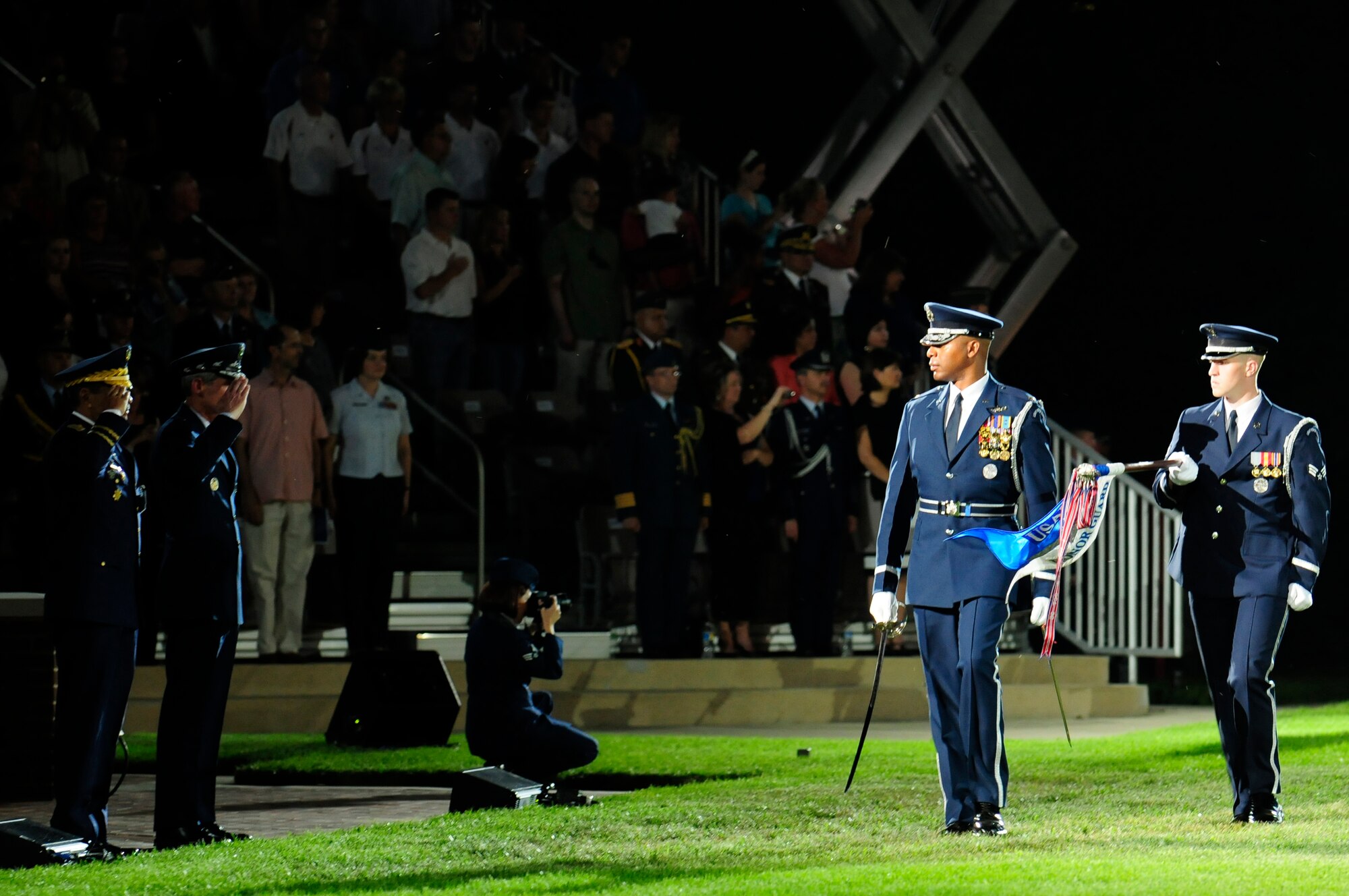 Gen. Norton A. Schwartz, chief of staff, and Maj. Gen. Carlos R. M. Altuna Tezanos, Dominican air force chief of staff, salute during the Twilight Tattoo pass in review June 13 at the U.S. Air Force Ceremonial Lawn. General Schwartz hosted the event celebrating "50 Years of Friendship and Cooperation" between nations belonging to the System of Cooperation among American Air Forces. (U.S. Air Force photo by Staff Sgt. Raymond Mills)