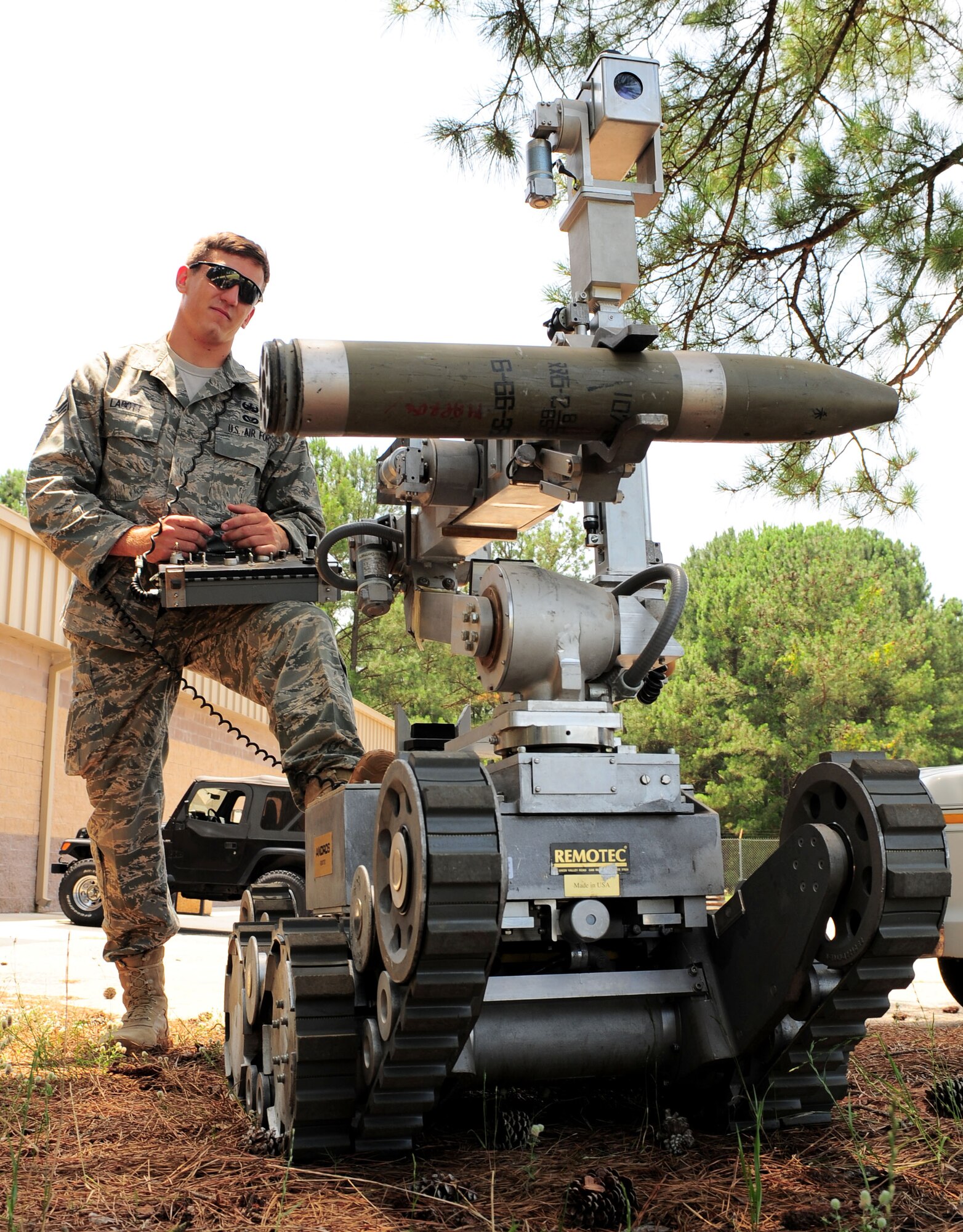 100611-F-8454M-014 SHAW AIR FORCE BASE, S.C. -- Senior Airman Joshua Labott, 20th Explosive Ordinance Disposal apprentice, shows off the capabilities of the Remote Operated Neutralizer System (RONS) June 11, 2010.  Airman Labott received the Bronze Star with the "V" for valor along with a purple heart for his actions in Afghanistan. (U.S. Air Force Photo/ Senior Airman David Minor)