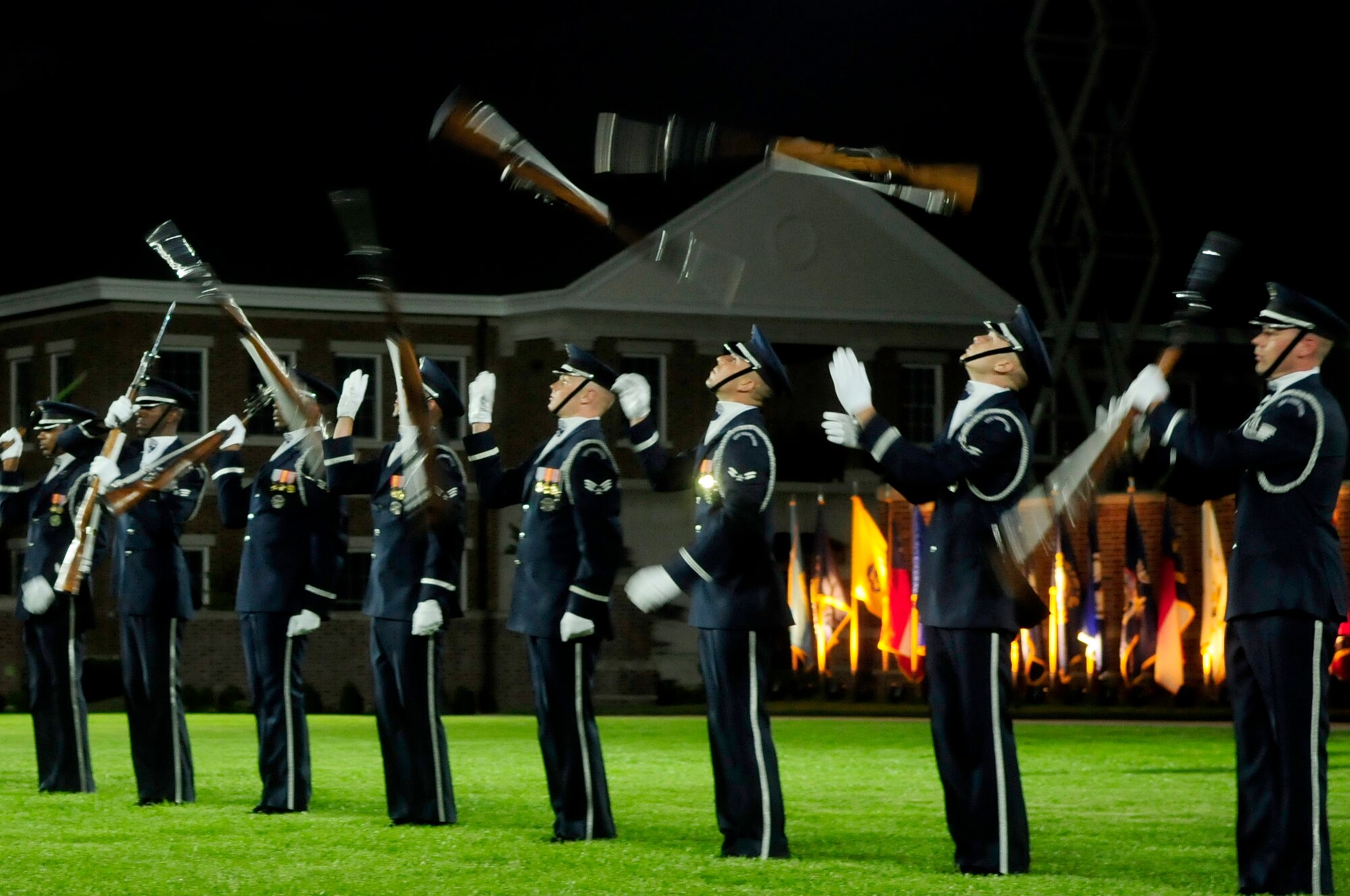 The United States Air Force Honor Guard Drill Team performs during the Conference of American Air Chiefs Twilight Tattoo June 13 at the U.S. Air Force Ceremonial Lawn on Bolling Air Force Base. Gen Norton A. Schwartz, U.S. Air Force chief of staff, hosted the event celebrating "50 Years of Friendship and Cooperation" between nations belonging to the System of Cooperation among American Air Forces. (U.S. Air Force photo by Staff Sgt. Raymond Mills)
