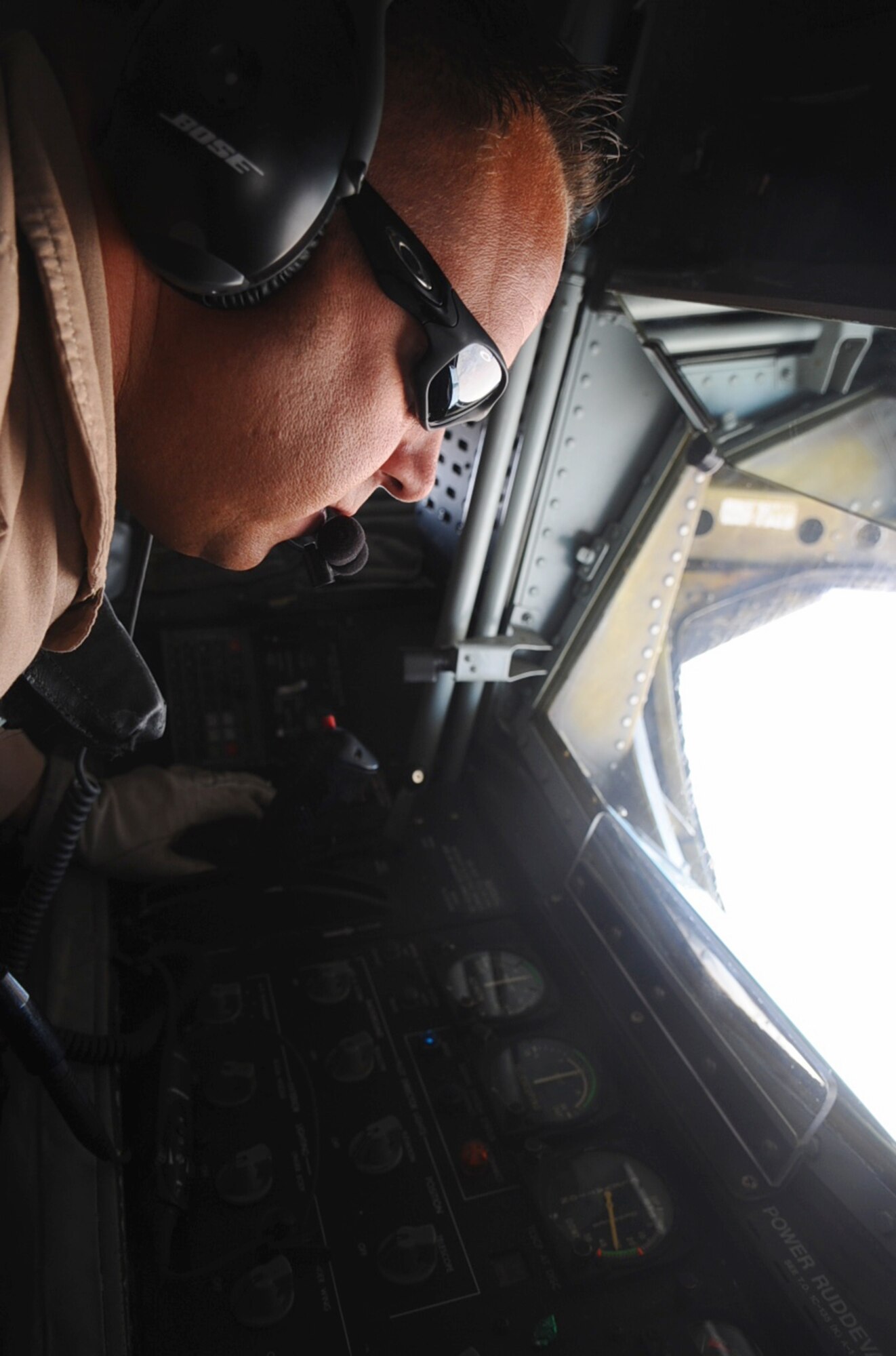 Tech. Sgt. Jeff Stoermer positions a refueling boom to refuel an E-3 Sentry May 25, 2010, while flying over Afghanistan.  Sergeant Stoermer is a 340th Expeditionary Air Refueling Squadron boom operator. (U.S. Air Force photo/Senior Airman Kasey Zickmund)