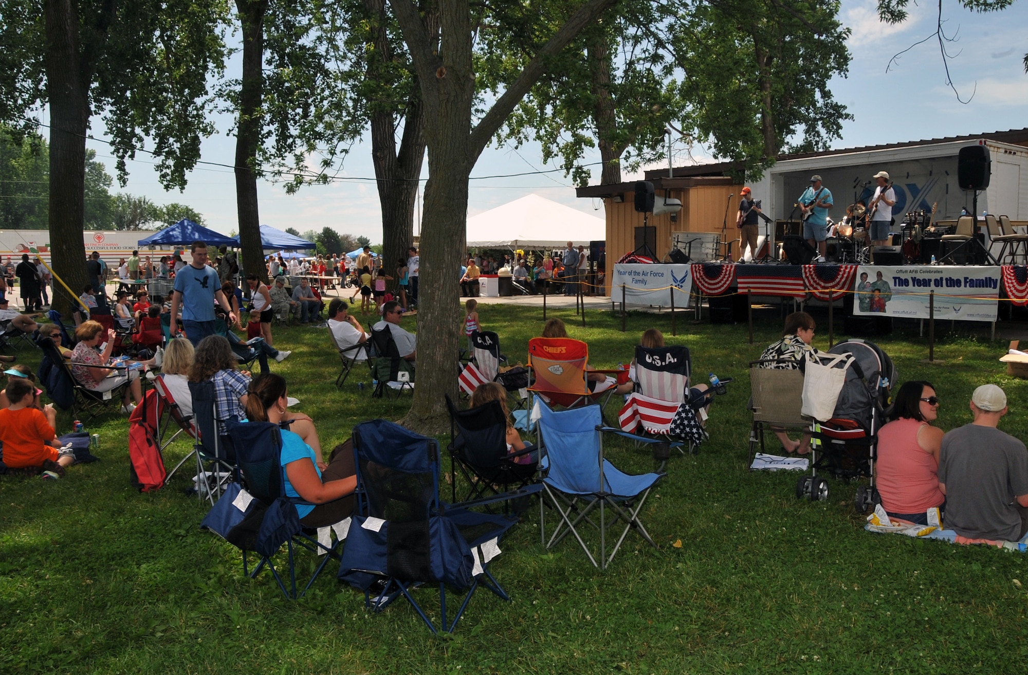OFFUTT AIR FORCE BASE, Neb. - The band Out of the Fire entertains the crowd at the Offutt Advisory Council's Annual Offutt Appreciation Picnic June 11. Team Offutt members spent the day at the base lake enjoying free food, beverages and entertainment courtesy of the community support organization.   U.S. Air Force photo by Jeff W. Gates 